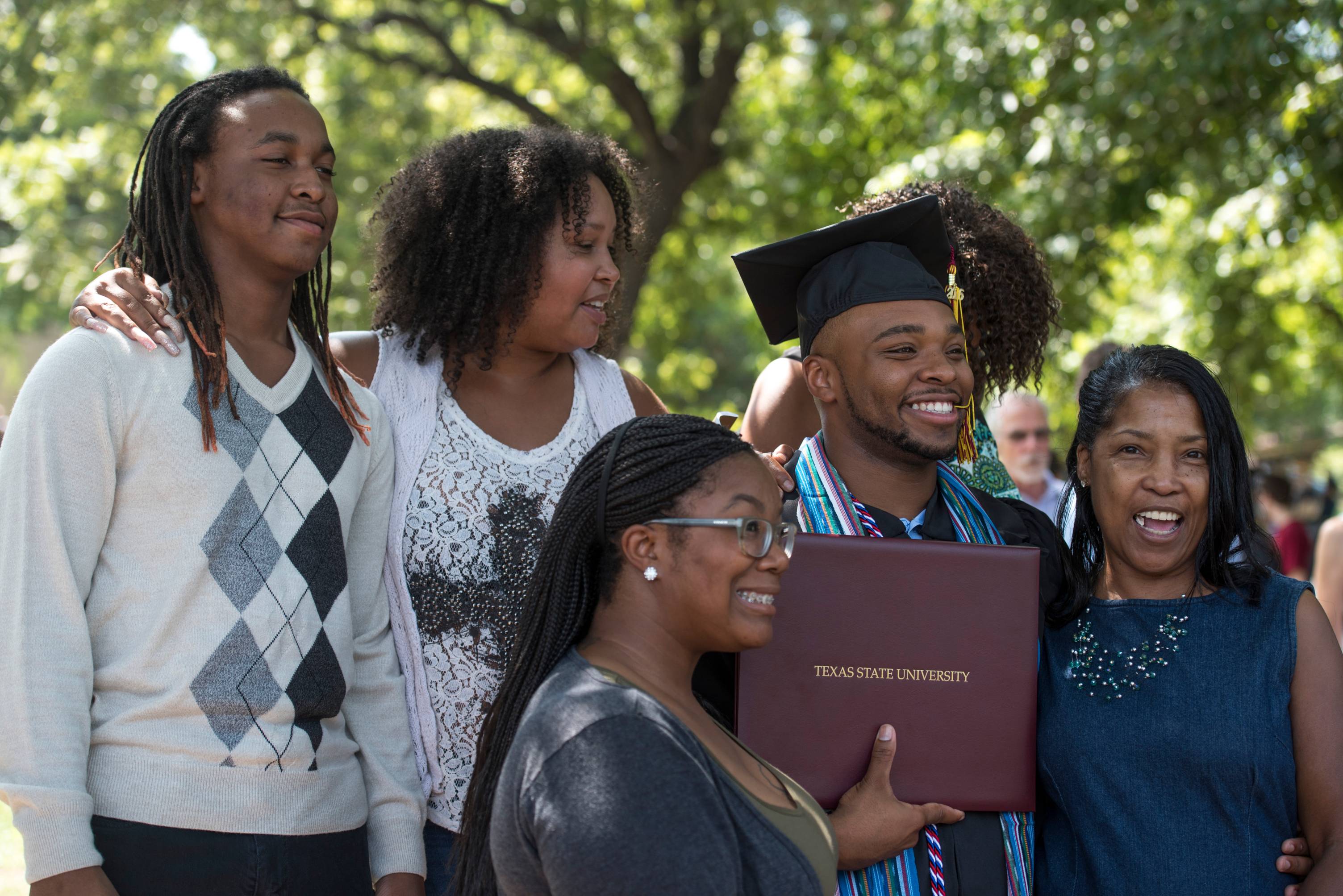 Picture of a family at graduation.