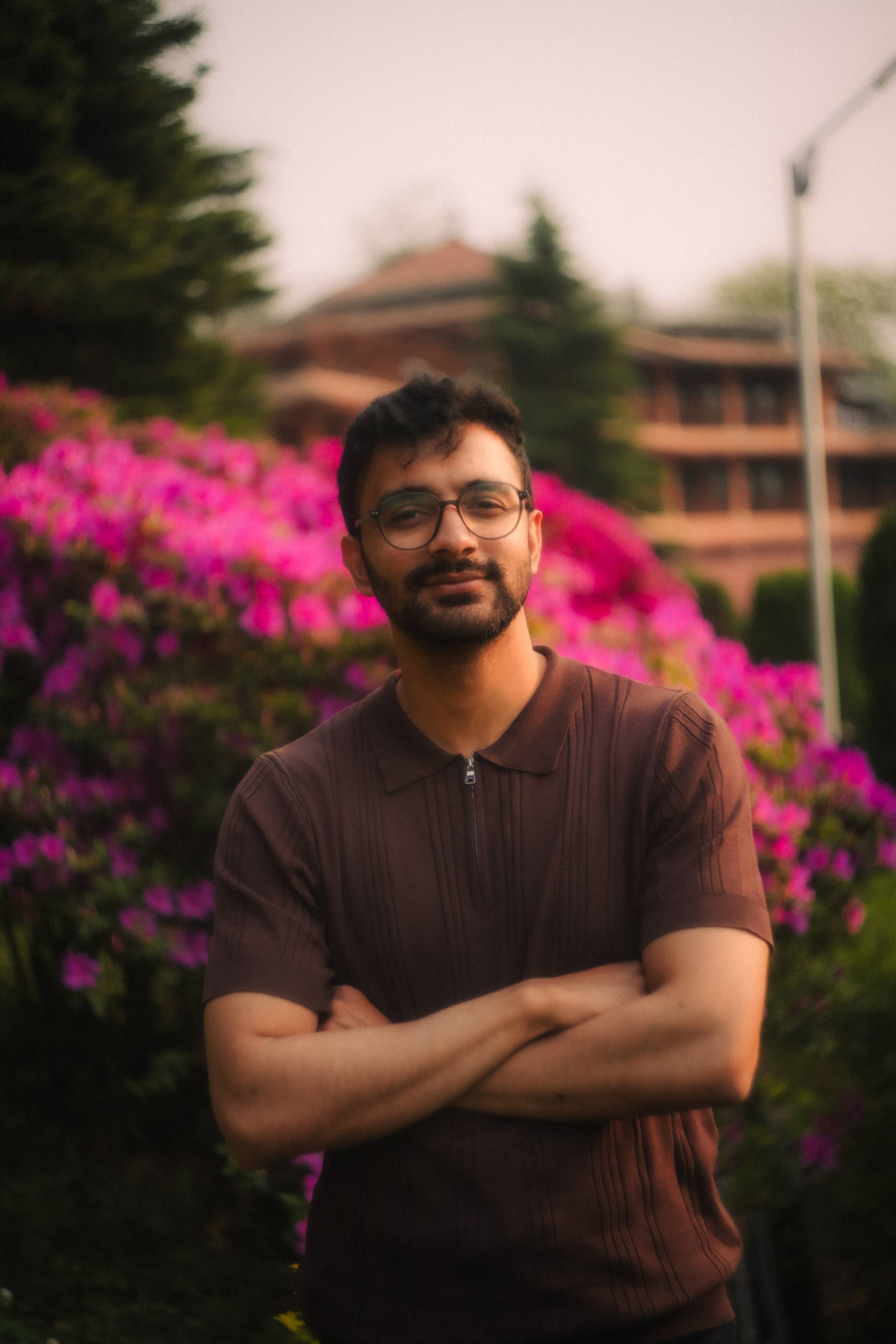 Sandesh is posing outside of the Round Rock campus.