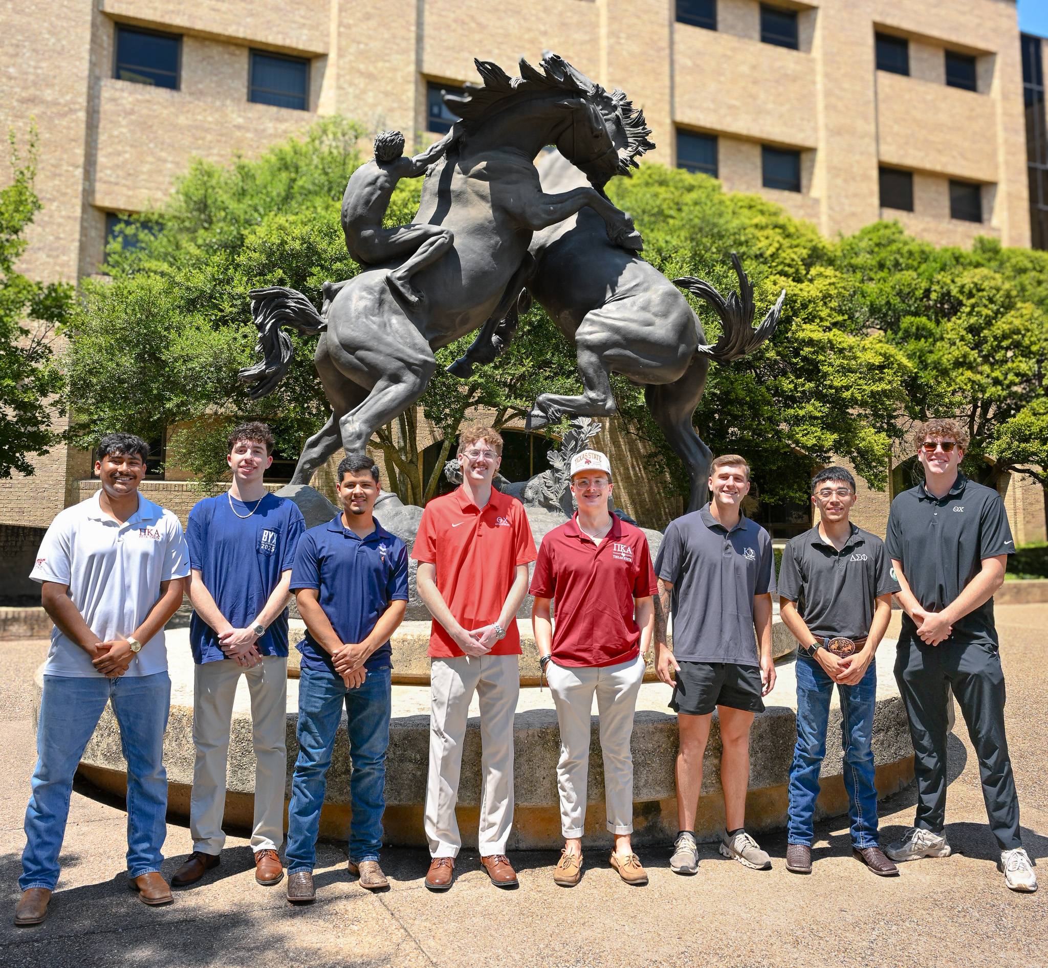 IFC men posing at tailgate