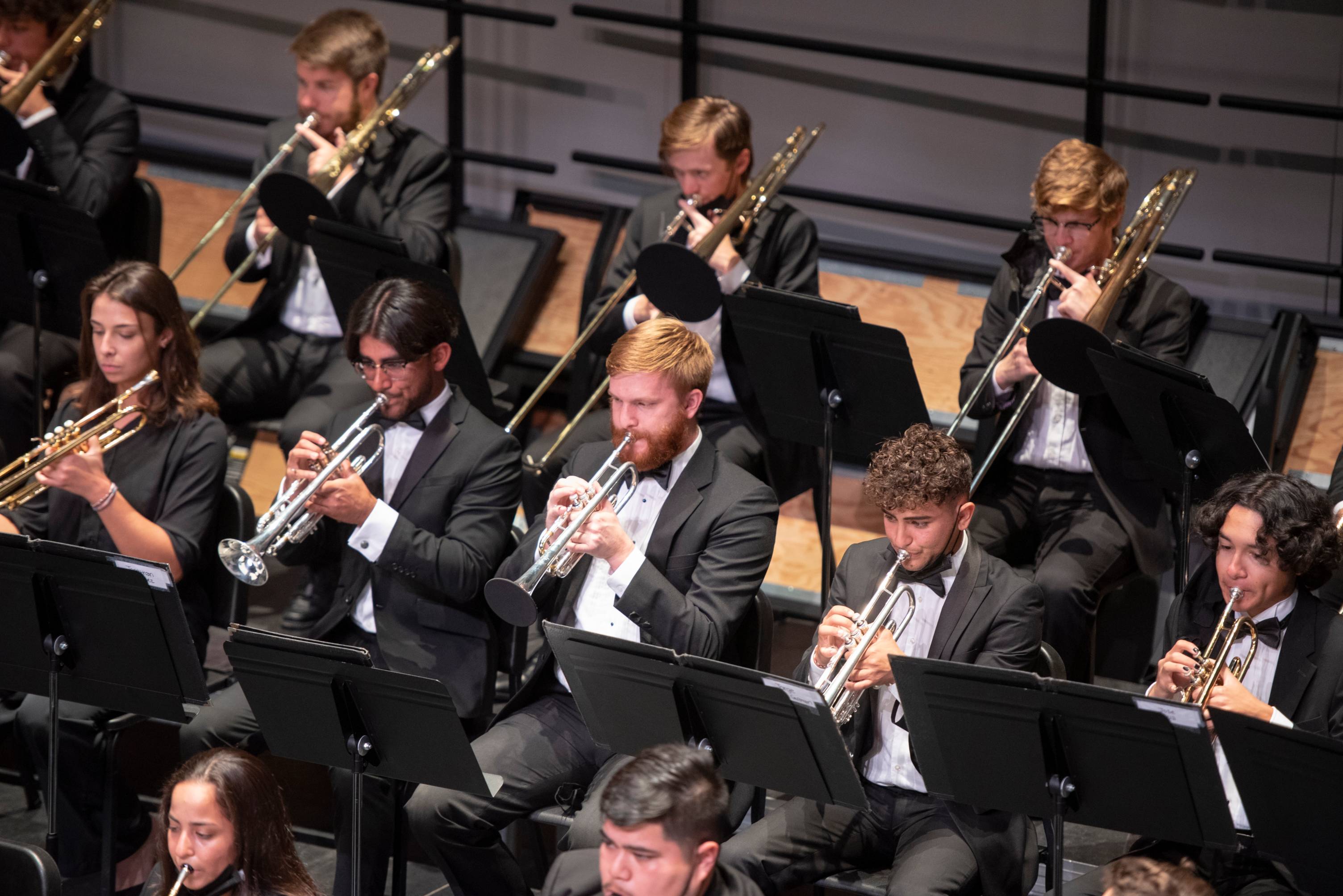 A group of trumpet players in the music department performing a music piece.