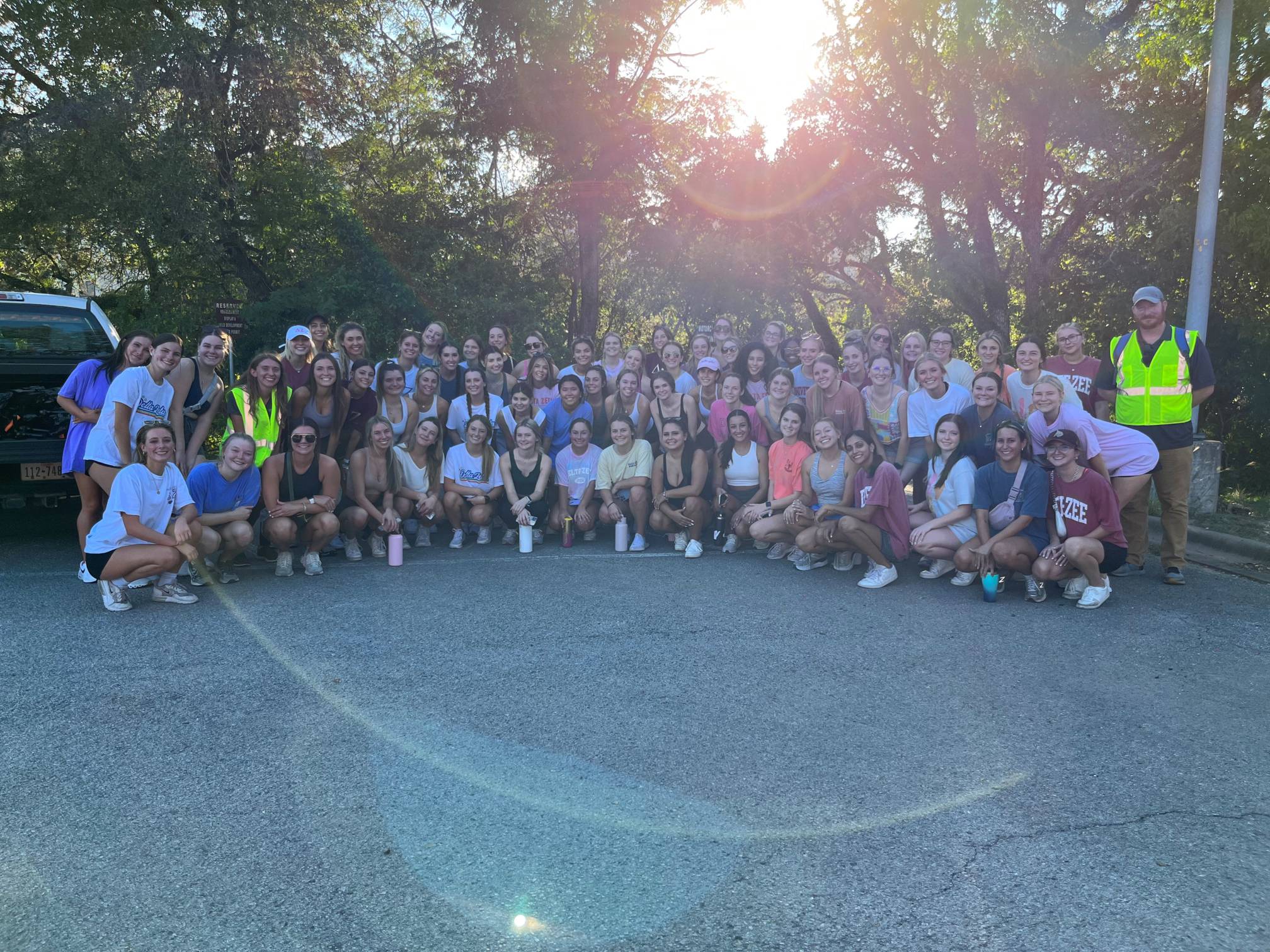 The Delta Zeta members pose with two EHS Specialist after cleaning up litter around the Glade