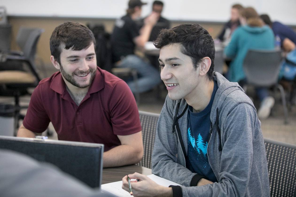 two male students in class