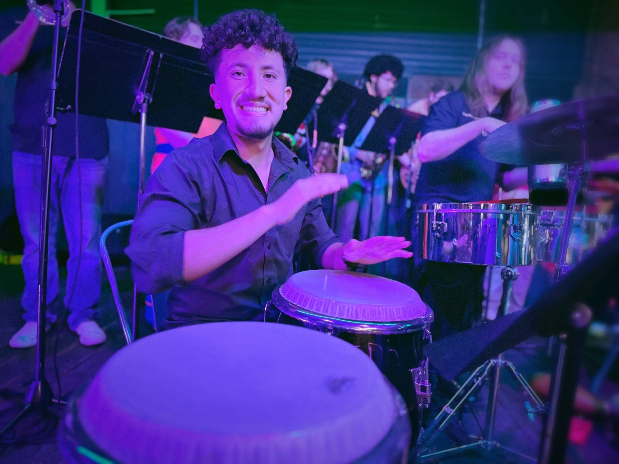 Student musicians singing salsa music during salsa night