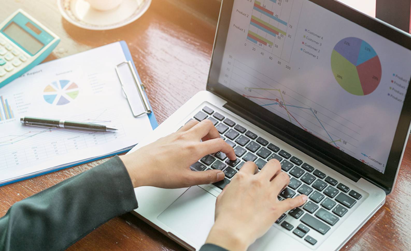 Person sitting in front of a computer with Excel open.