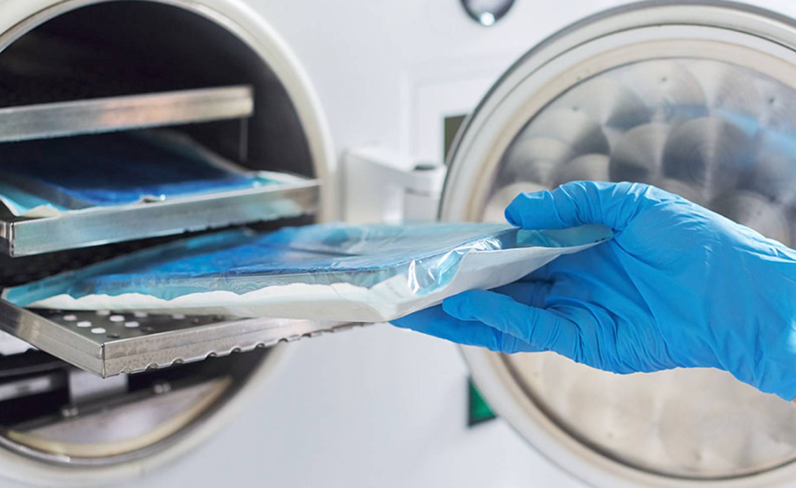 A sterile processing worker cleaning surgical tools. 
