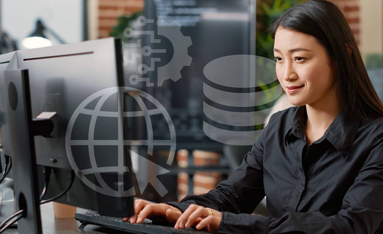 woman in black typing on computer 
