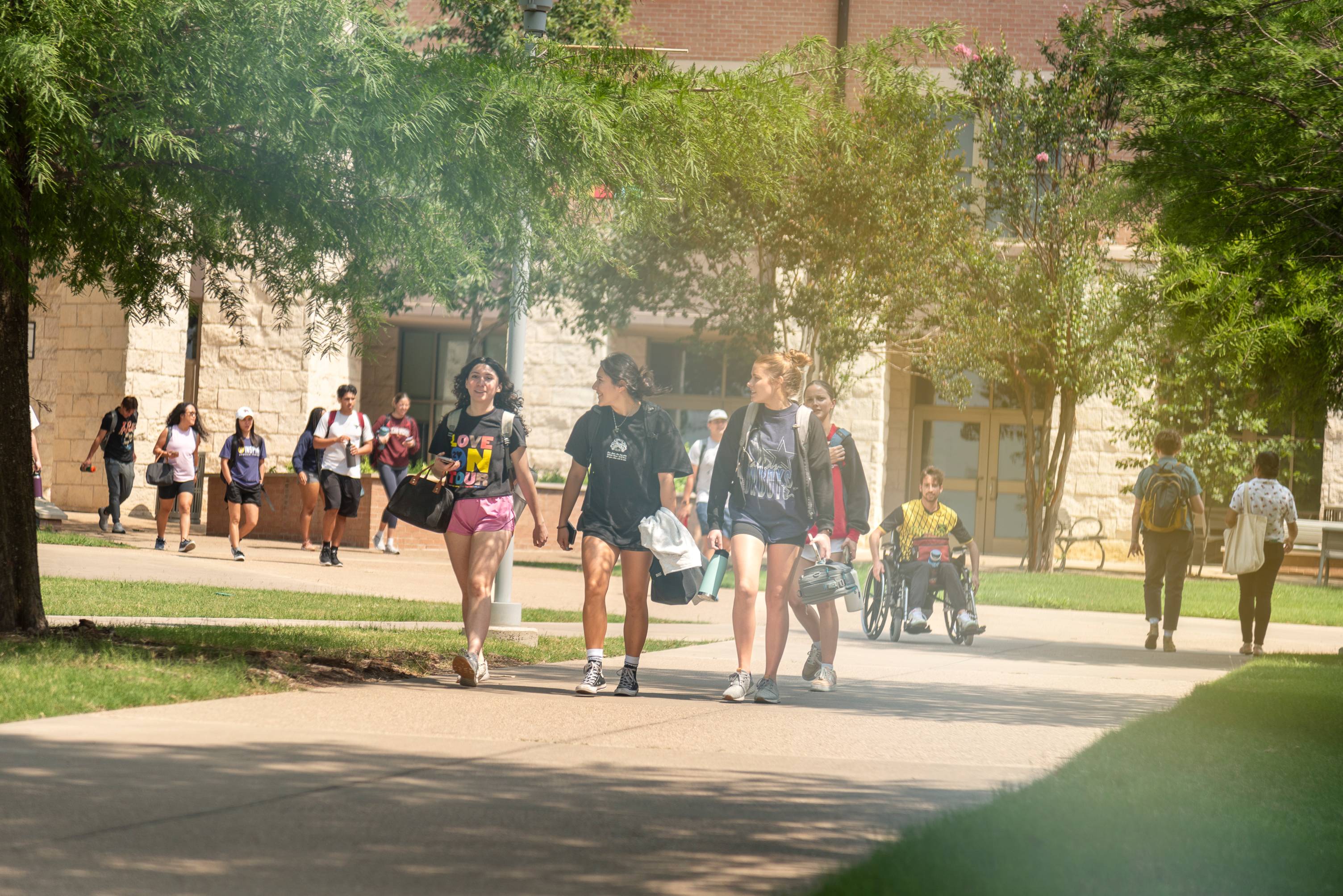 students walking on sidewalk of txst round rock campus