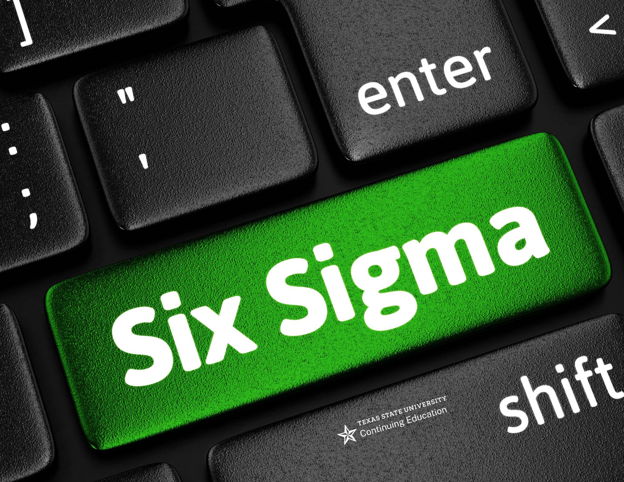 a black computer keyboard with one green key