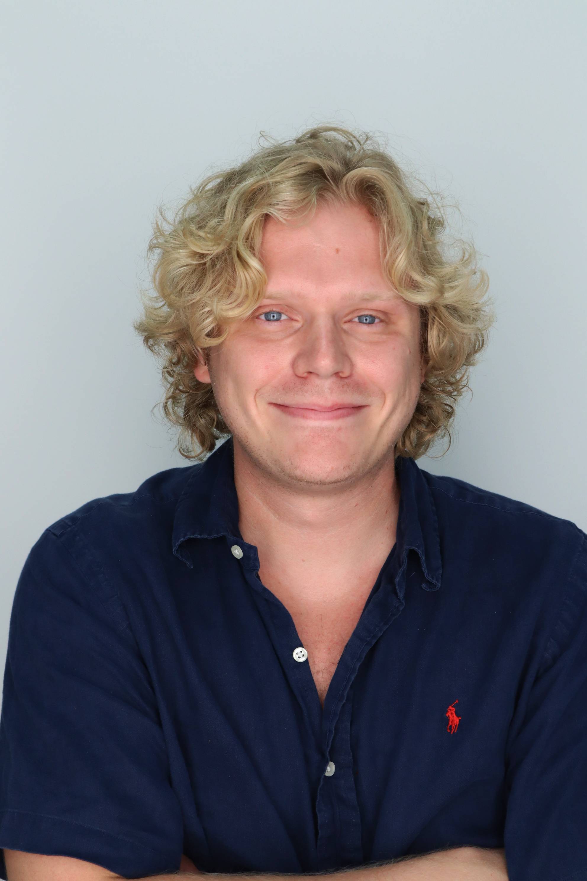 man wearing shirt with buttons