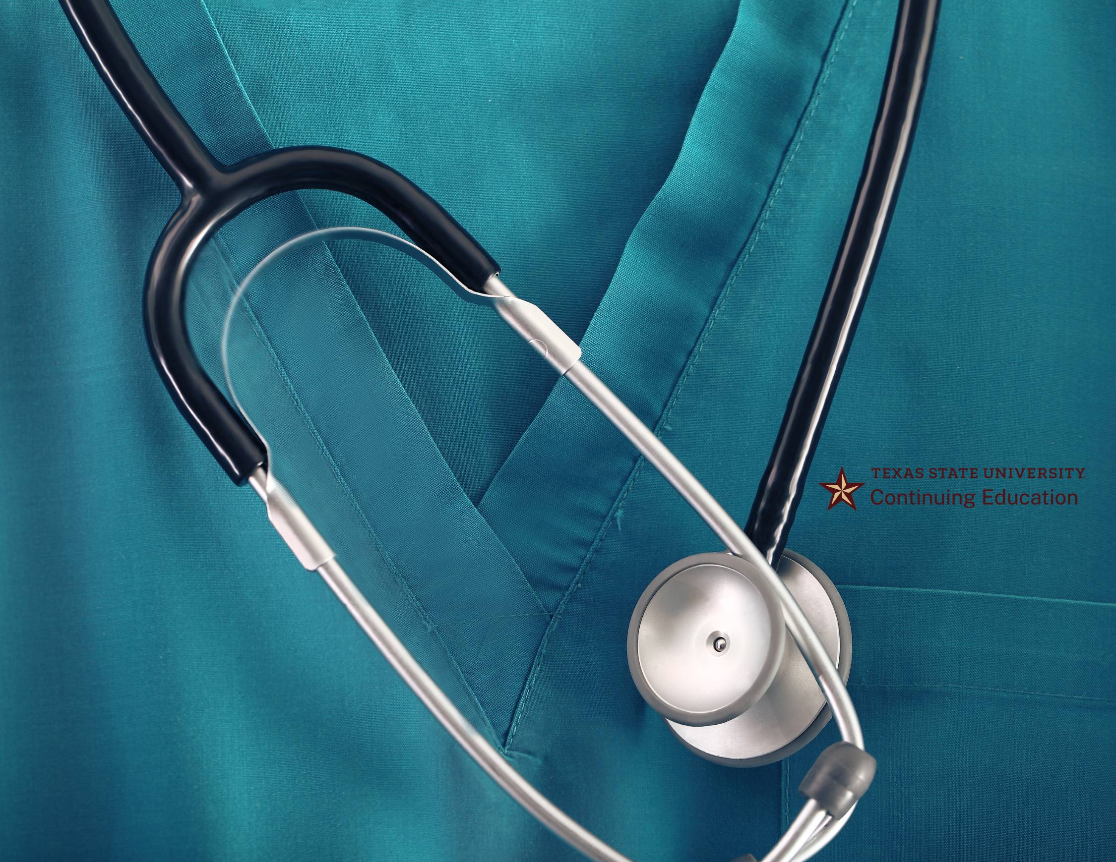 closeup on stethoscope over blue scrubs