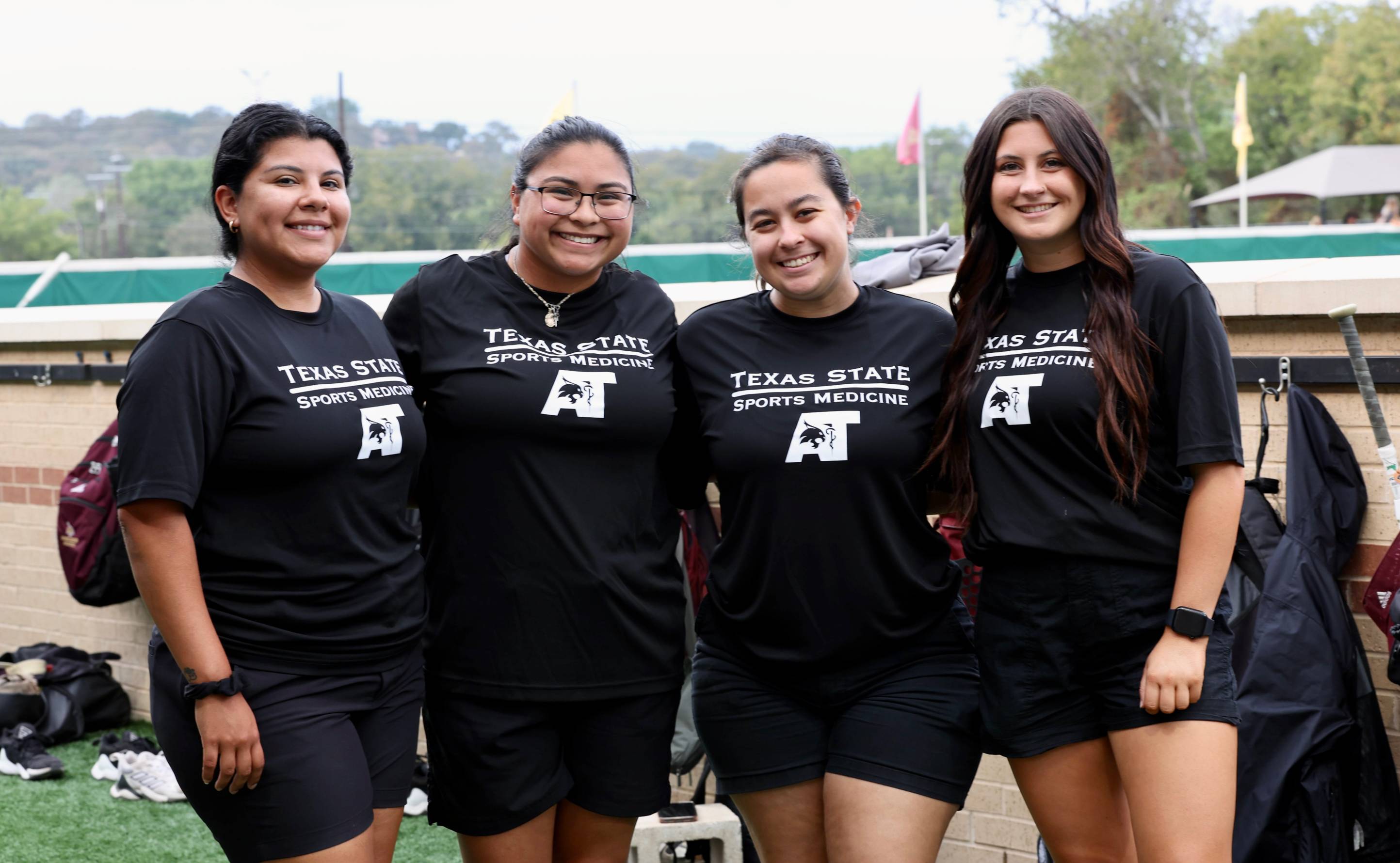 Phillips with athletic trainers