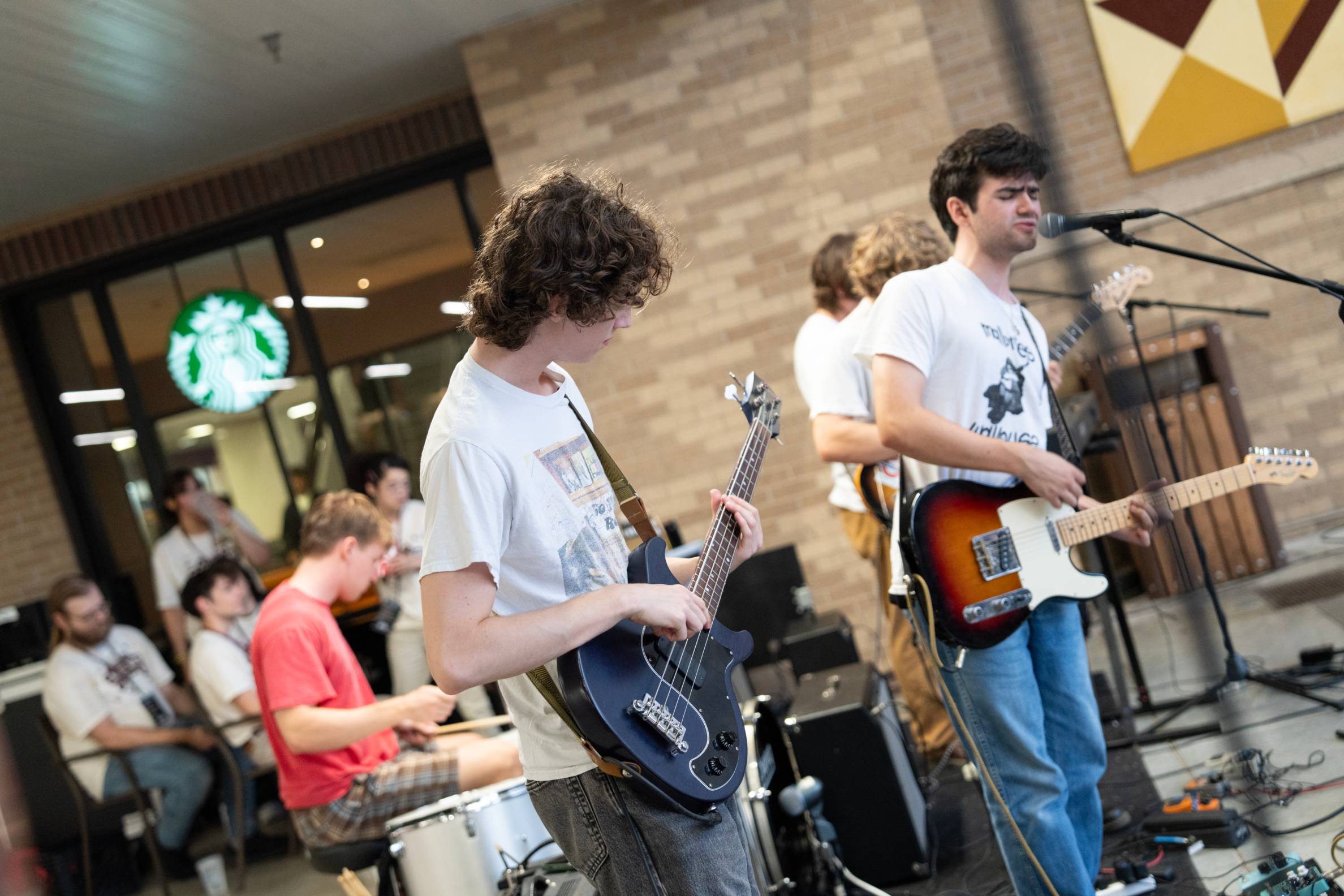 two guitar players on stage