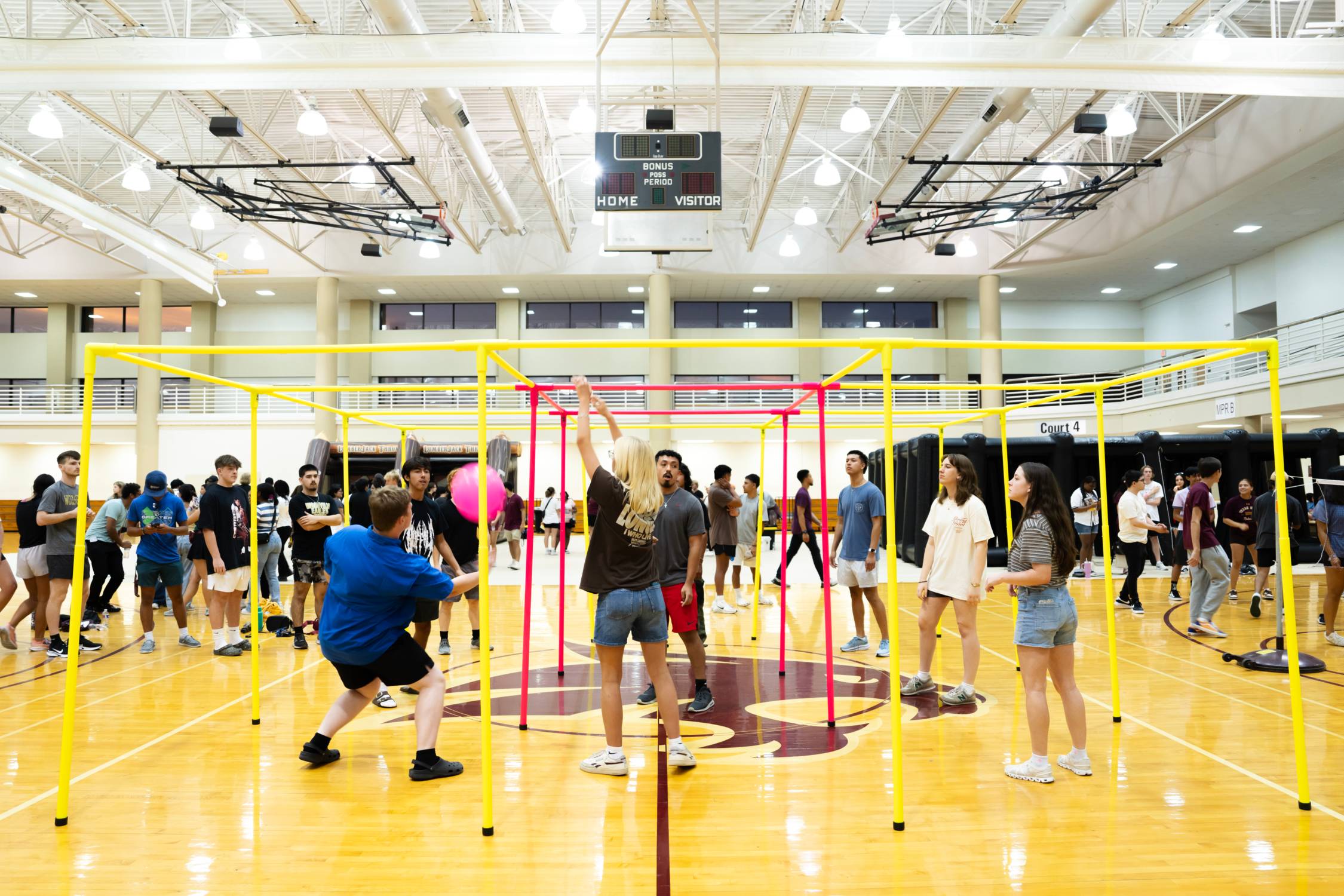 students playing a game on a basketball court