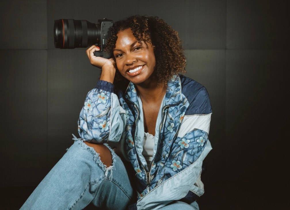 Portrait of Ashley Brown holding a camera