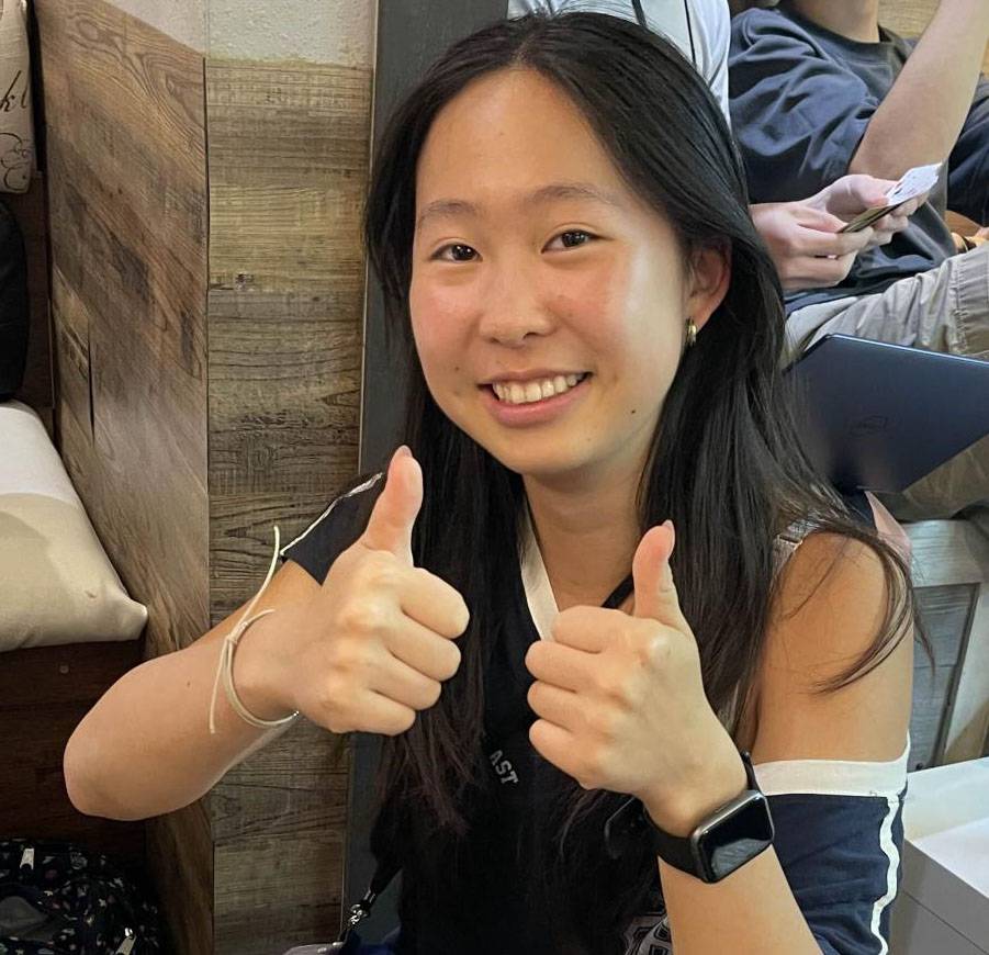 Girl giving two thumbs up!