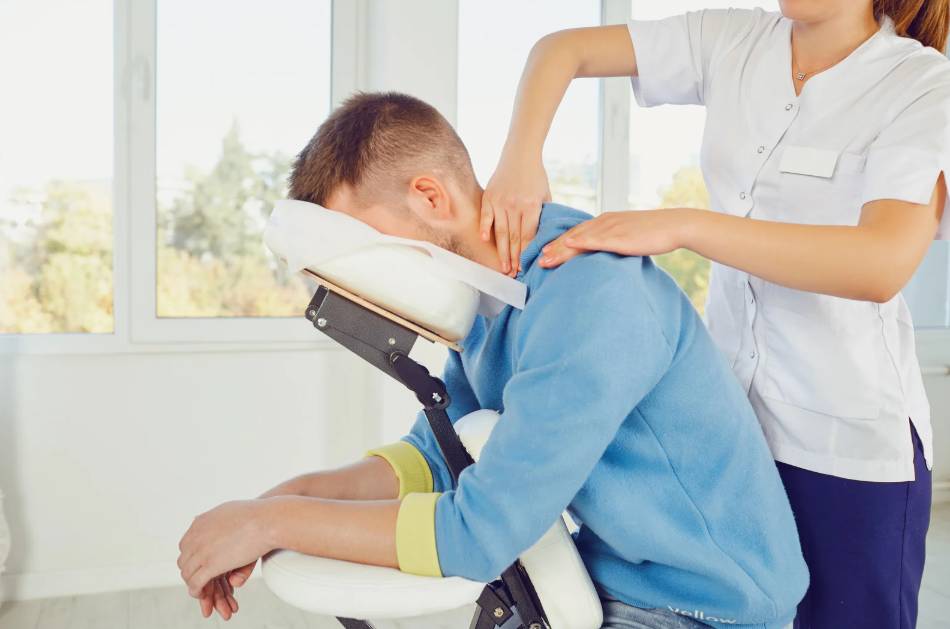 a person receiving a chair massage