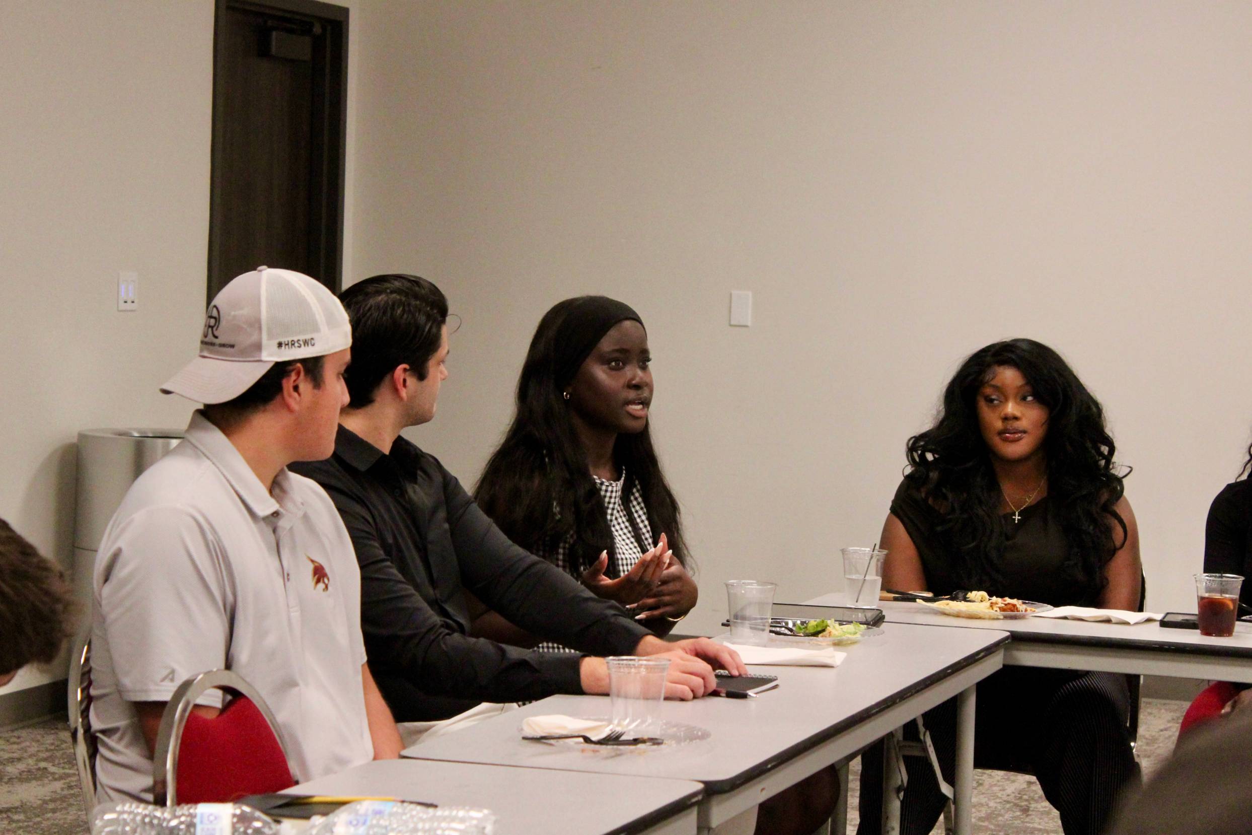 Students discussing at the Founders Table