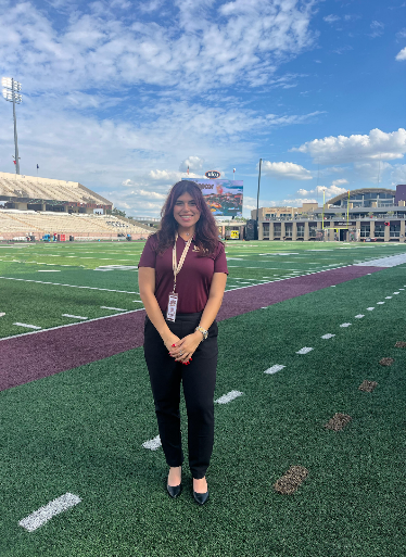 girl standing on football field