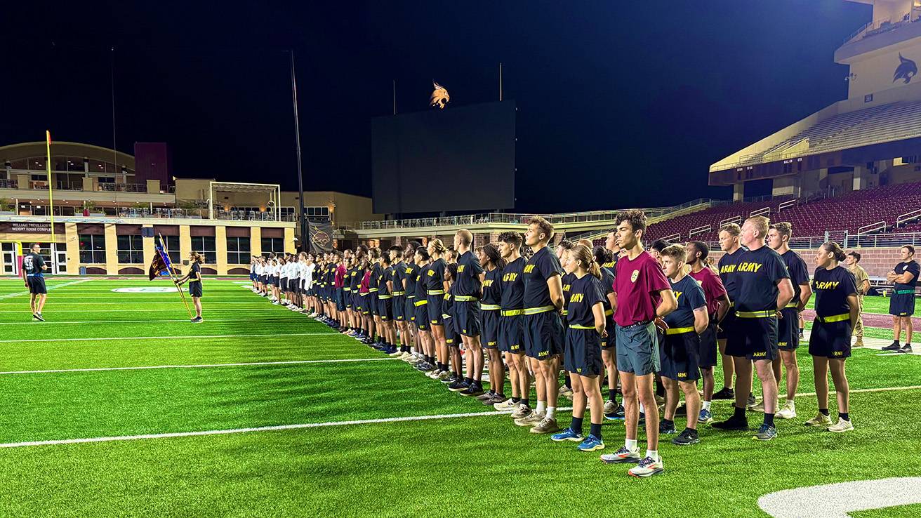 ROTC students pose for a group photo at UFCU Stadium.