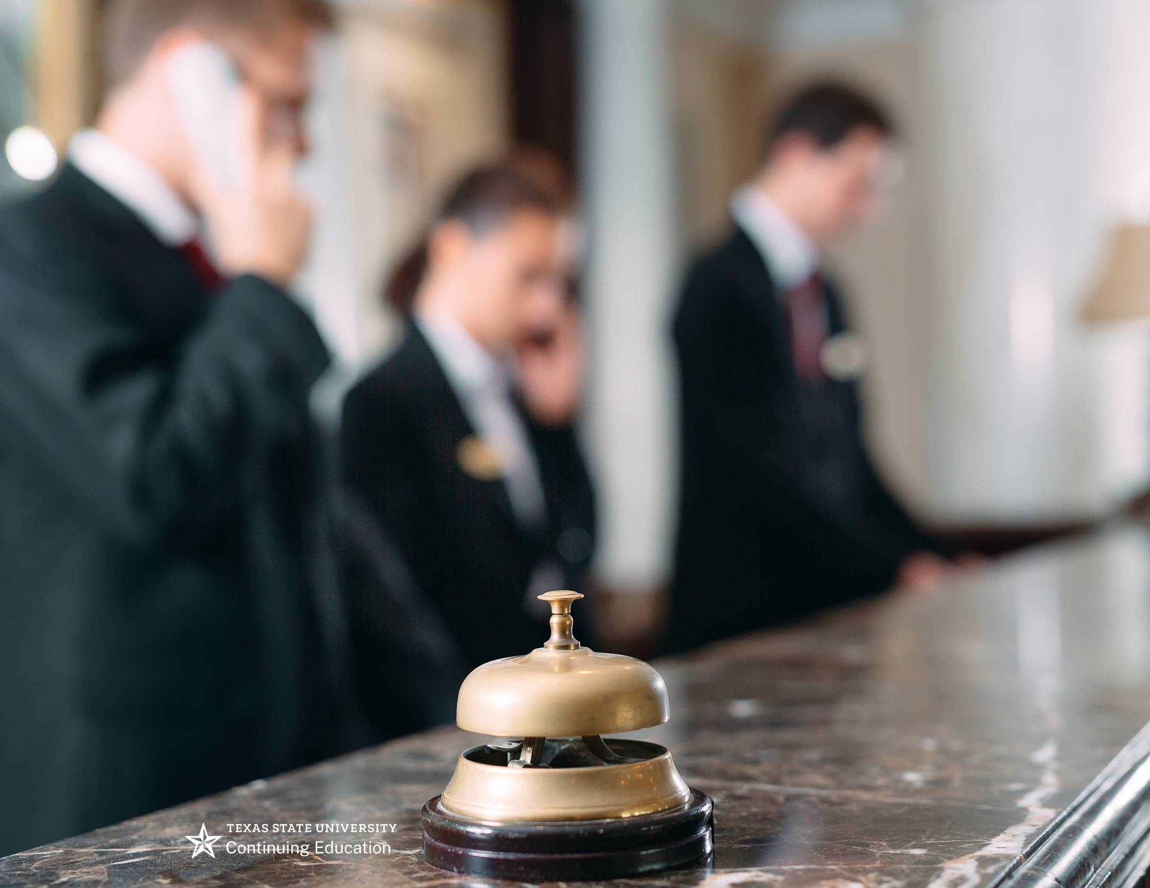 a hotel next to digital arrows in yellow