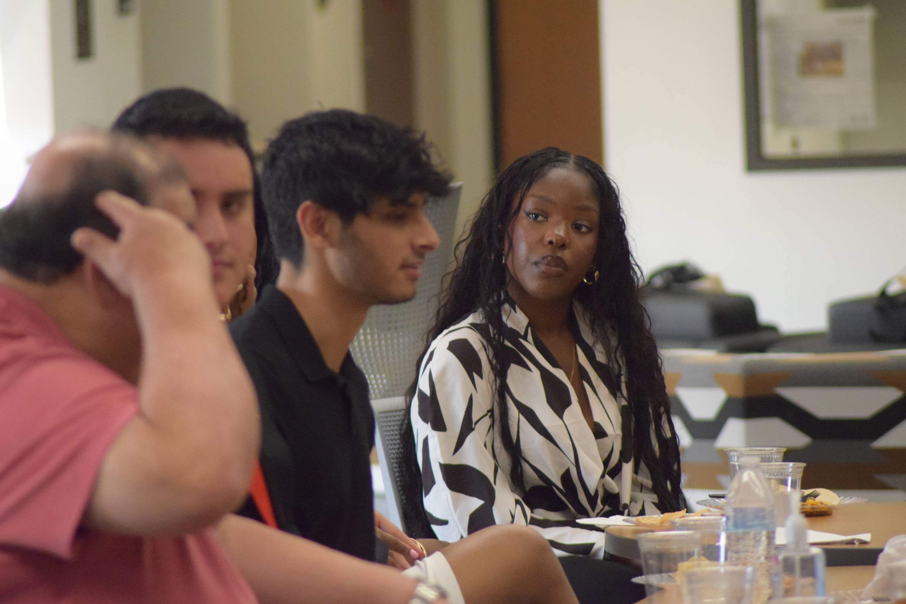 Student listening at the ROI Pitch competition.