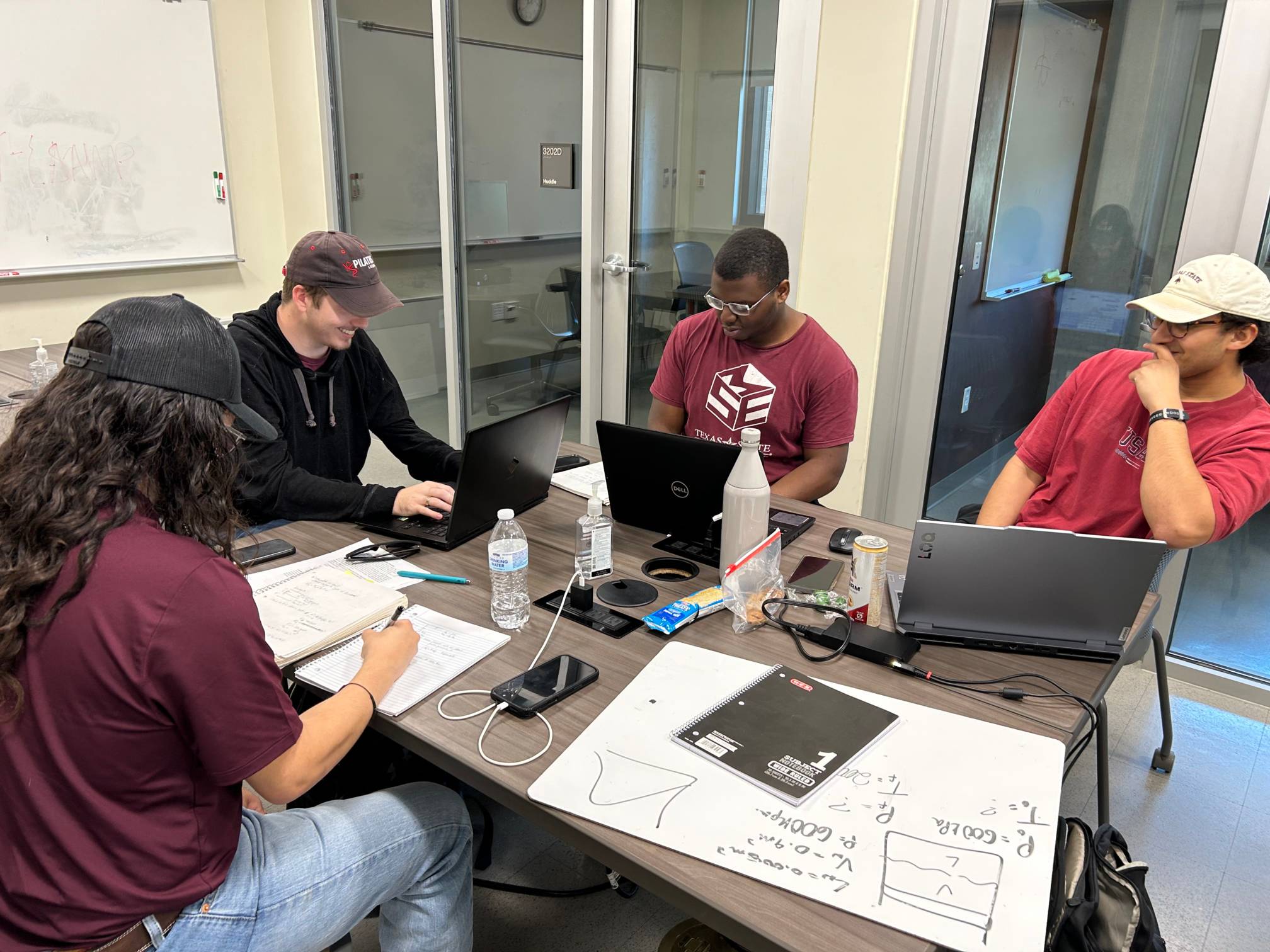 A group of students studying at a table