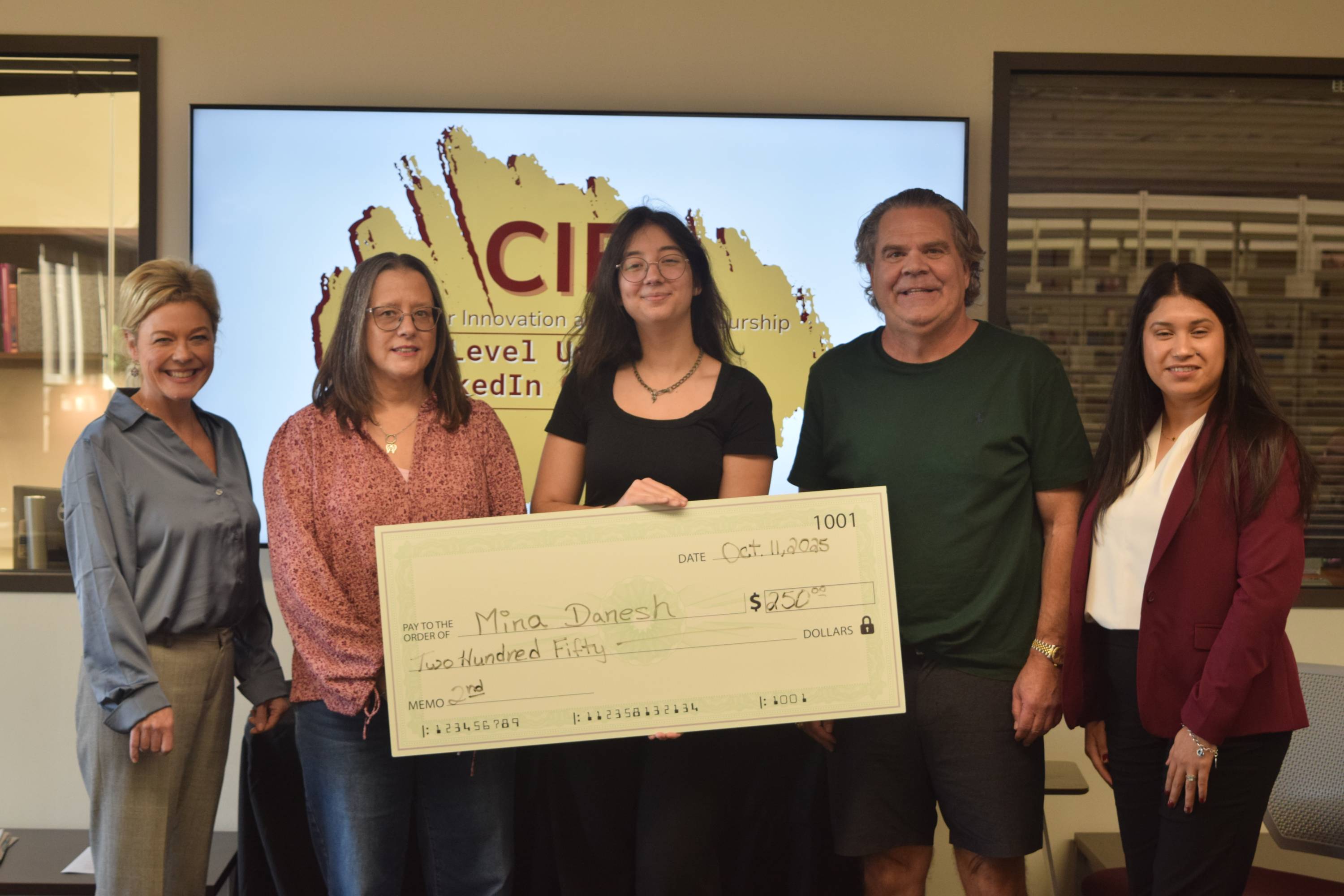 Second place winner with judges.