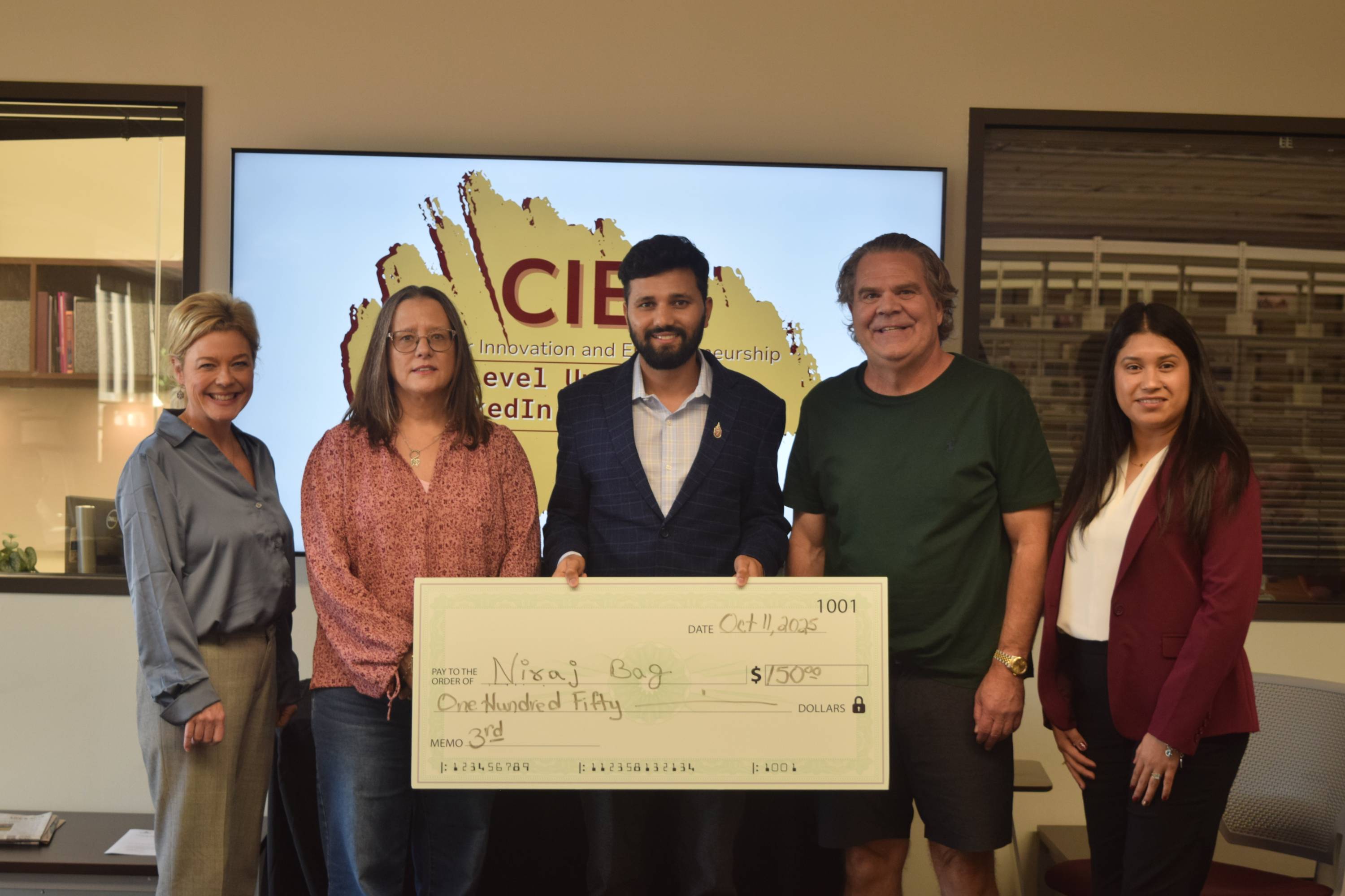 Third place winner with judges.