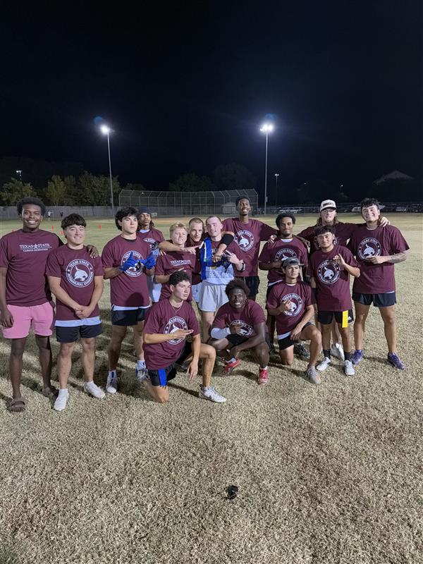 Fall 2025 Flag Football Fraternity Champions posing for a photo with champ shirts