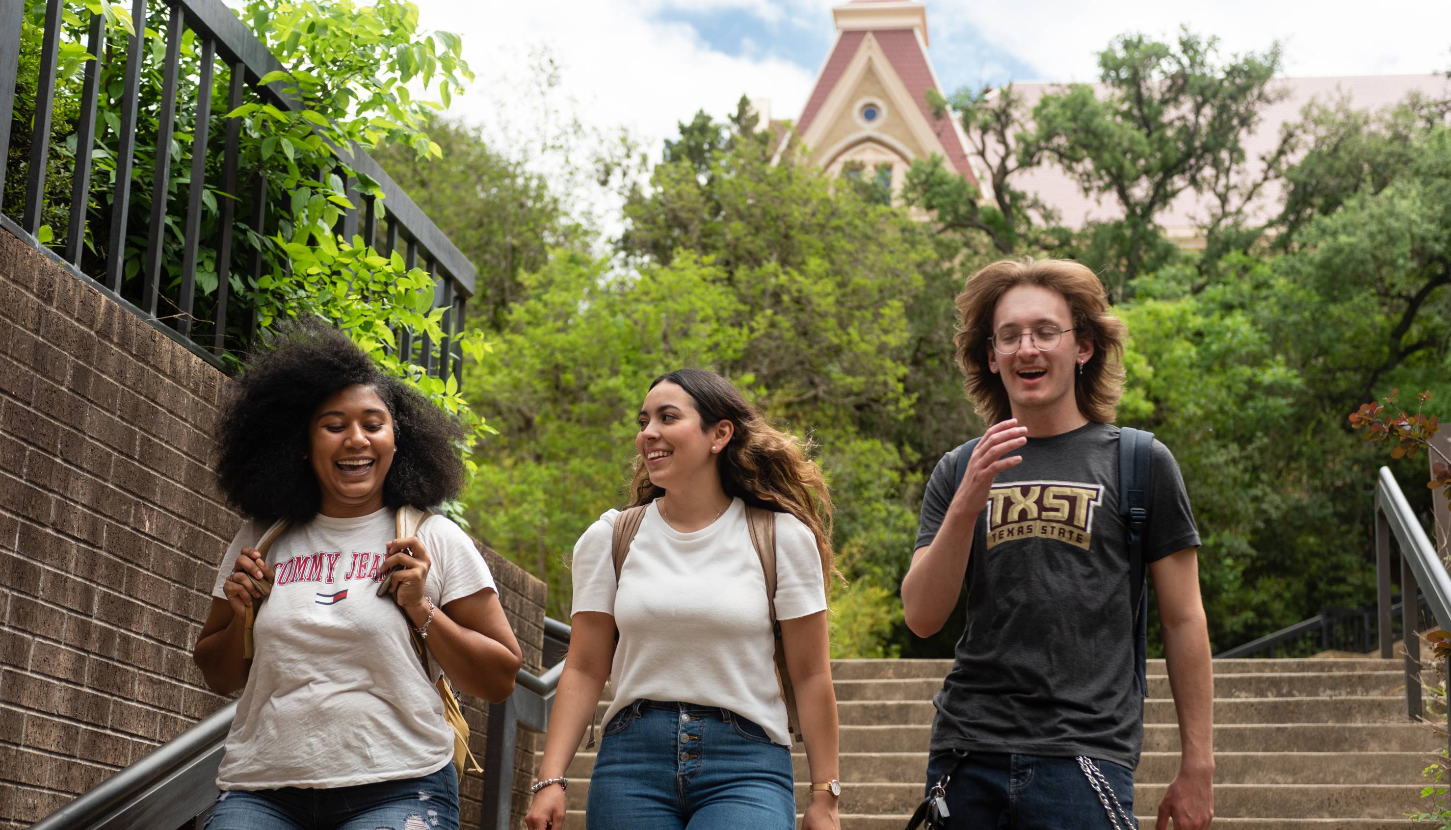 Students walking and smiling