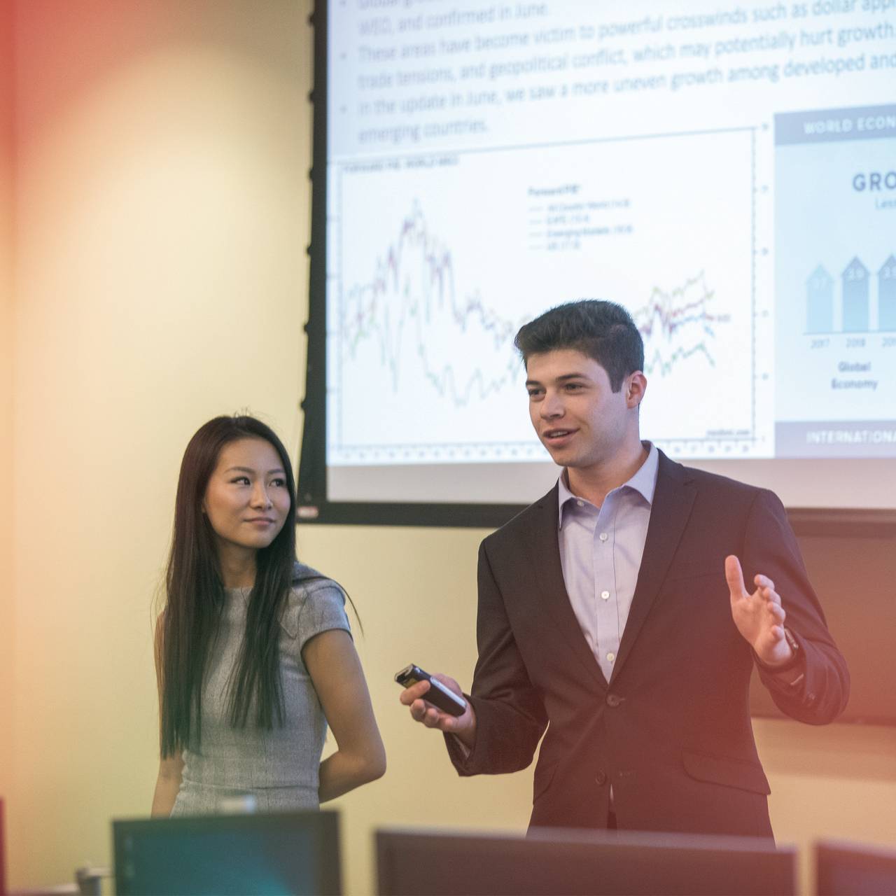 McCoy College of Business students lead a financial presentation at an event.