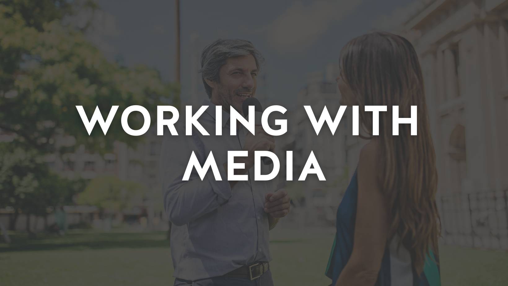 Reporter interviews a woman in front of a historic looking building. Overlayed text reads, "Working with Media"
