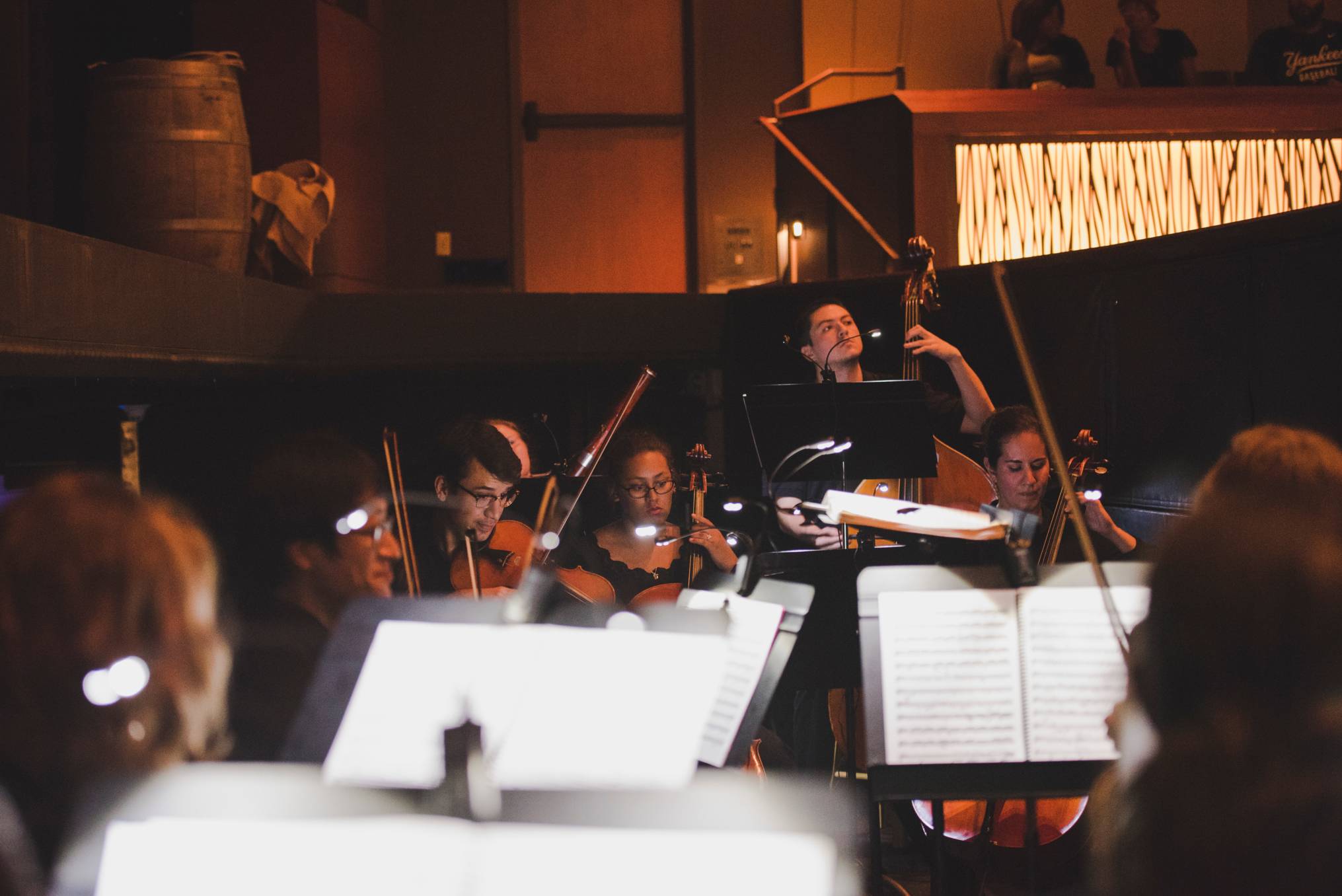 orchestra musicians and sheet music