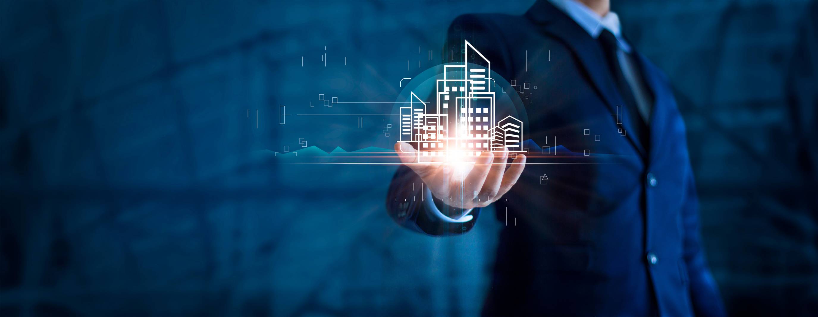 a man in a suit holding a digital image of a building