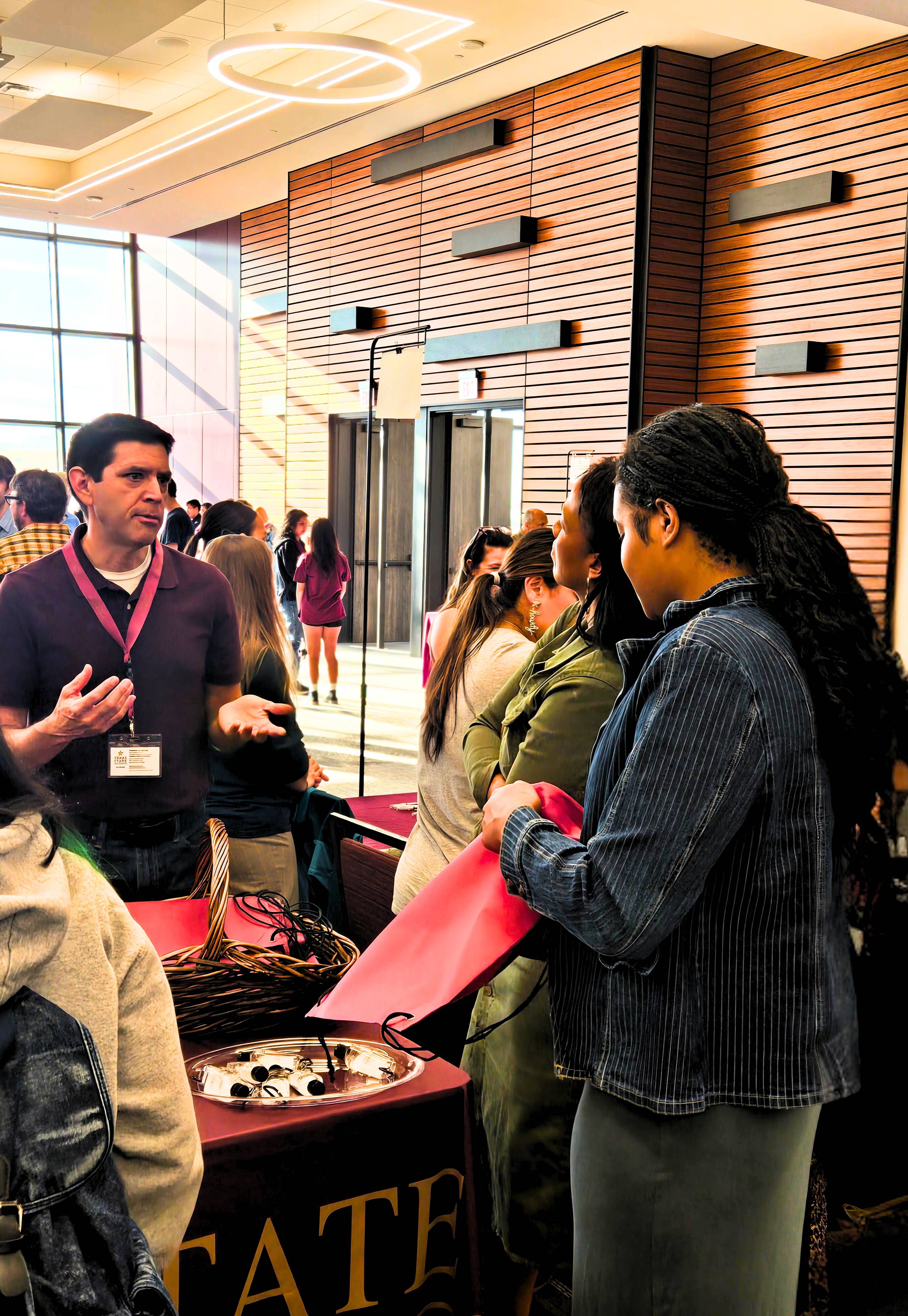 Stephen Garcia interacting with students on Bobcat Day