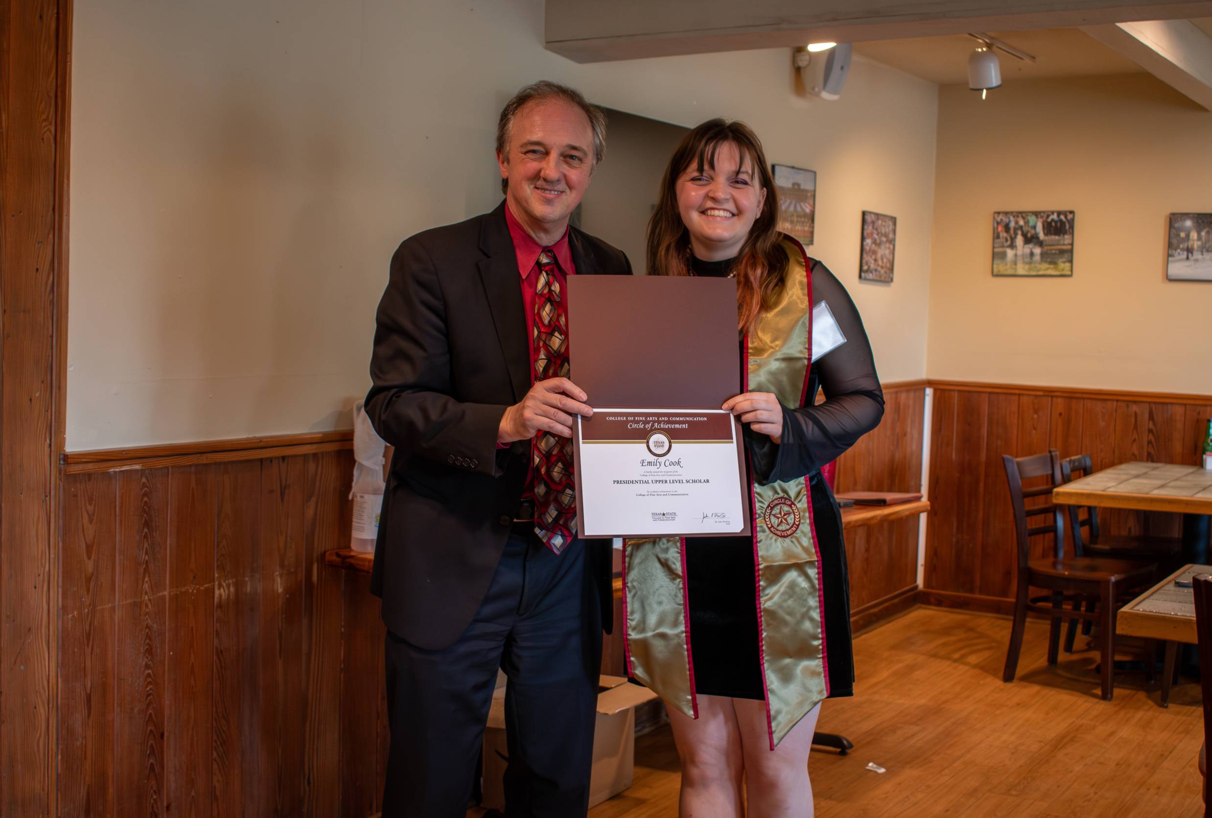Dean Fleming posing for a photo with a Circle of Achievement recipient
