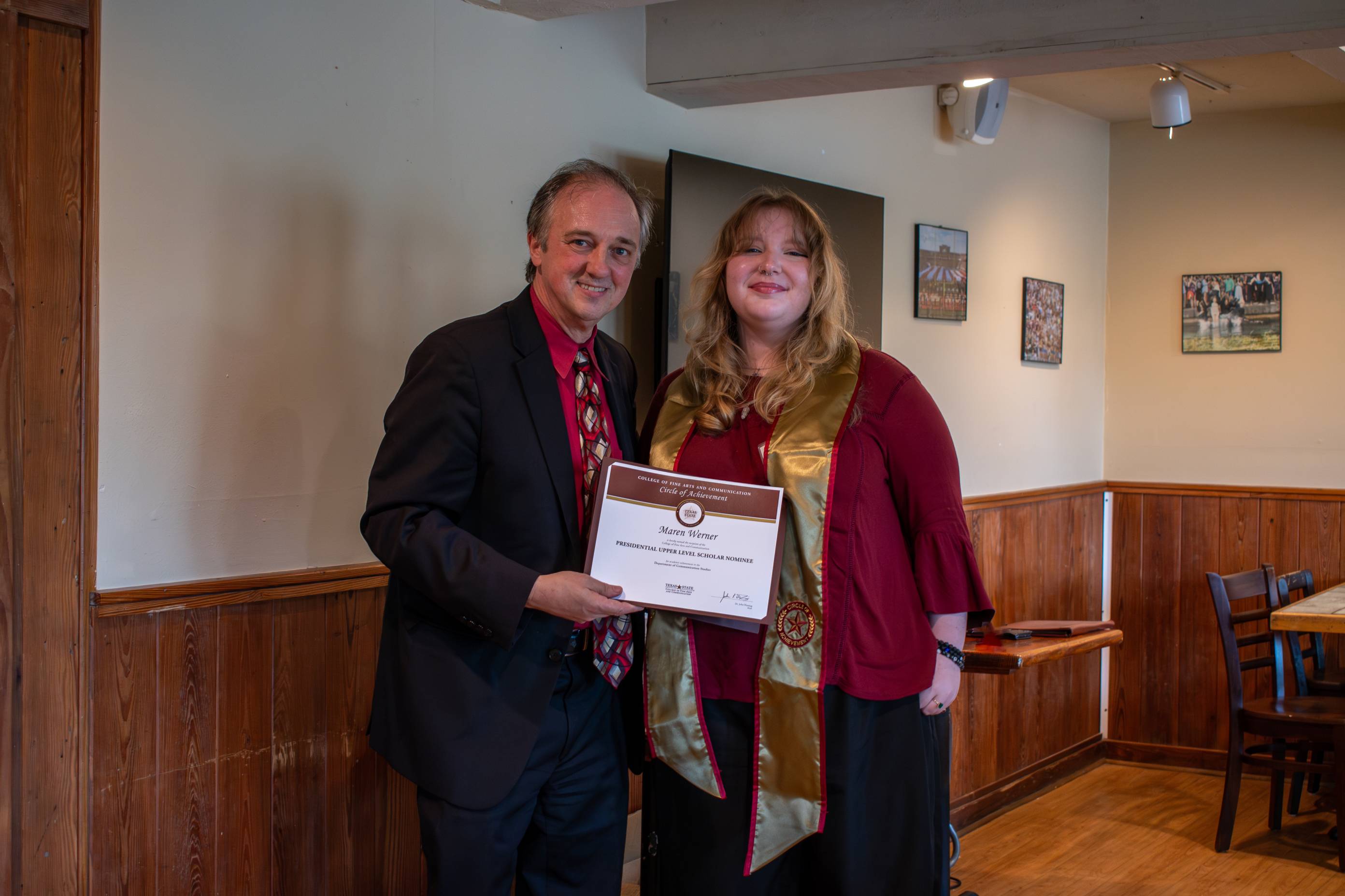Dean Fleming posing for a photo with a Circle of Achievement recipient