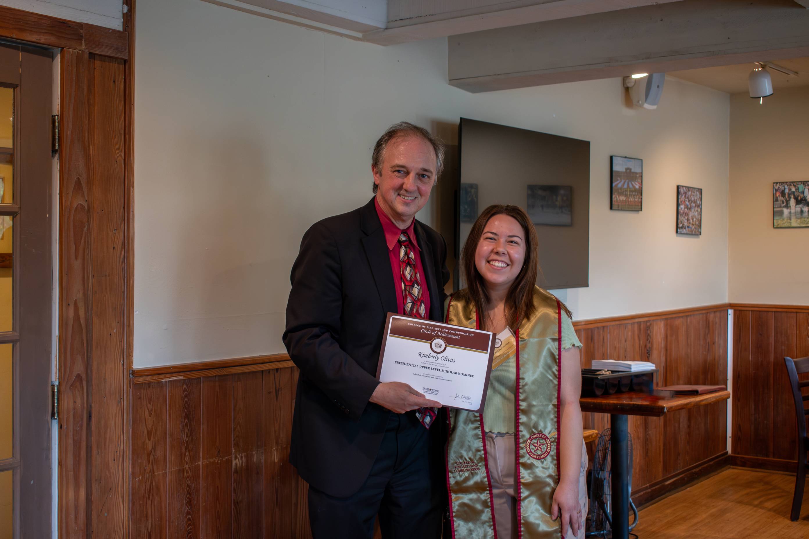 Dean Fleming posing for a photo with a Circle of Achievement recipient