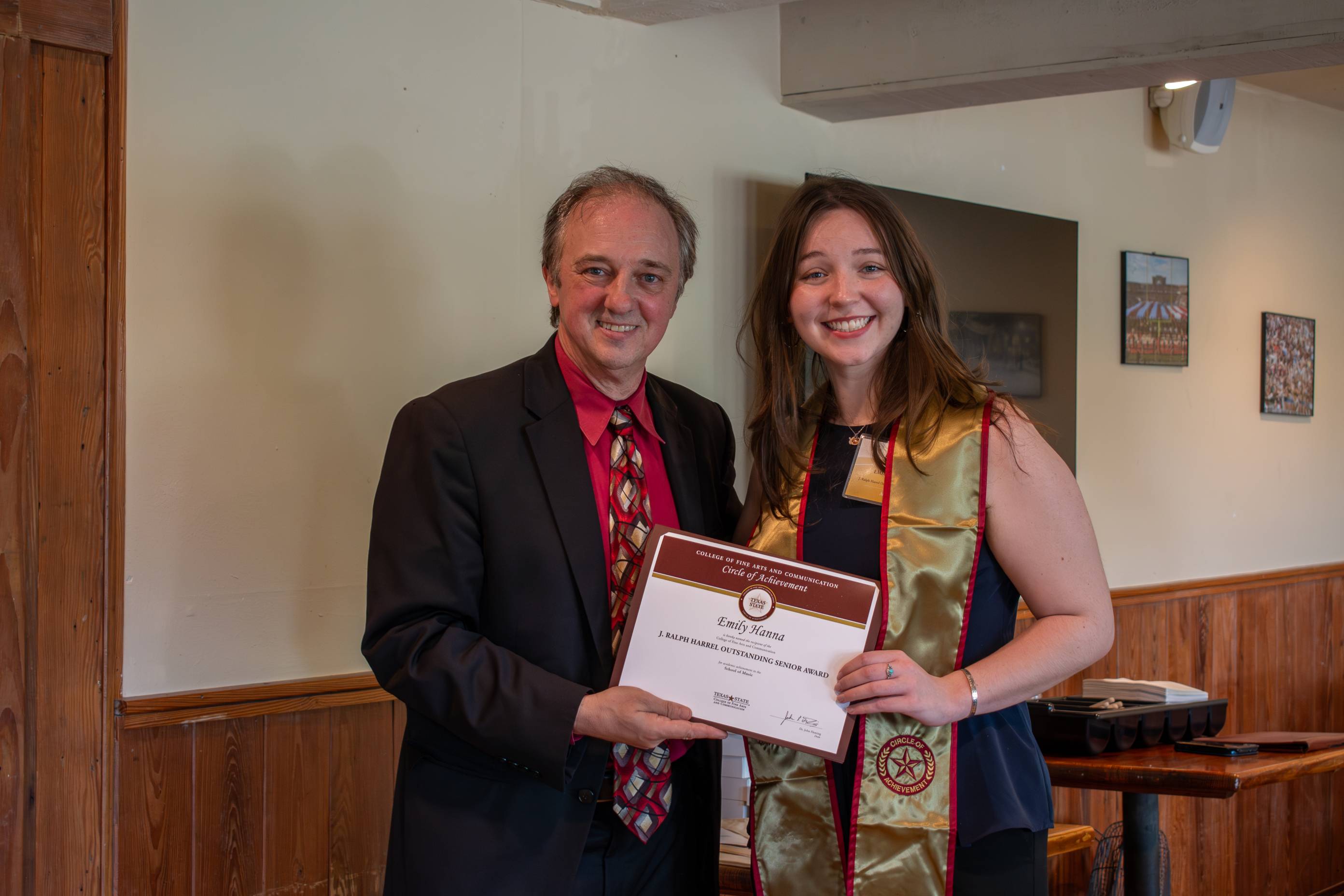 Dean Fleming posing for a photo with a Circle of Achievement recipient