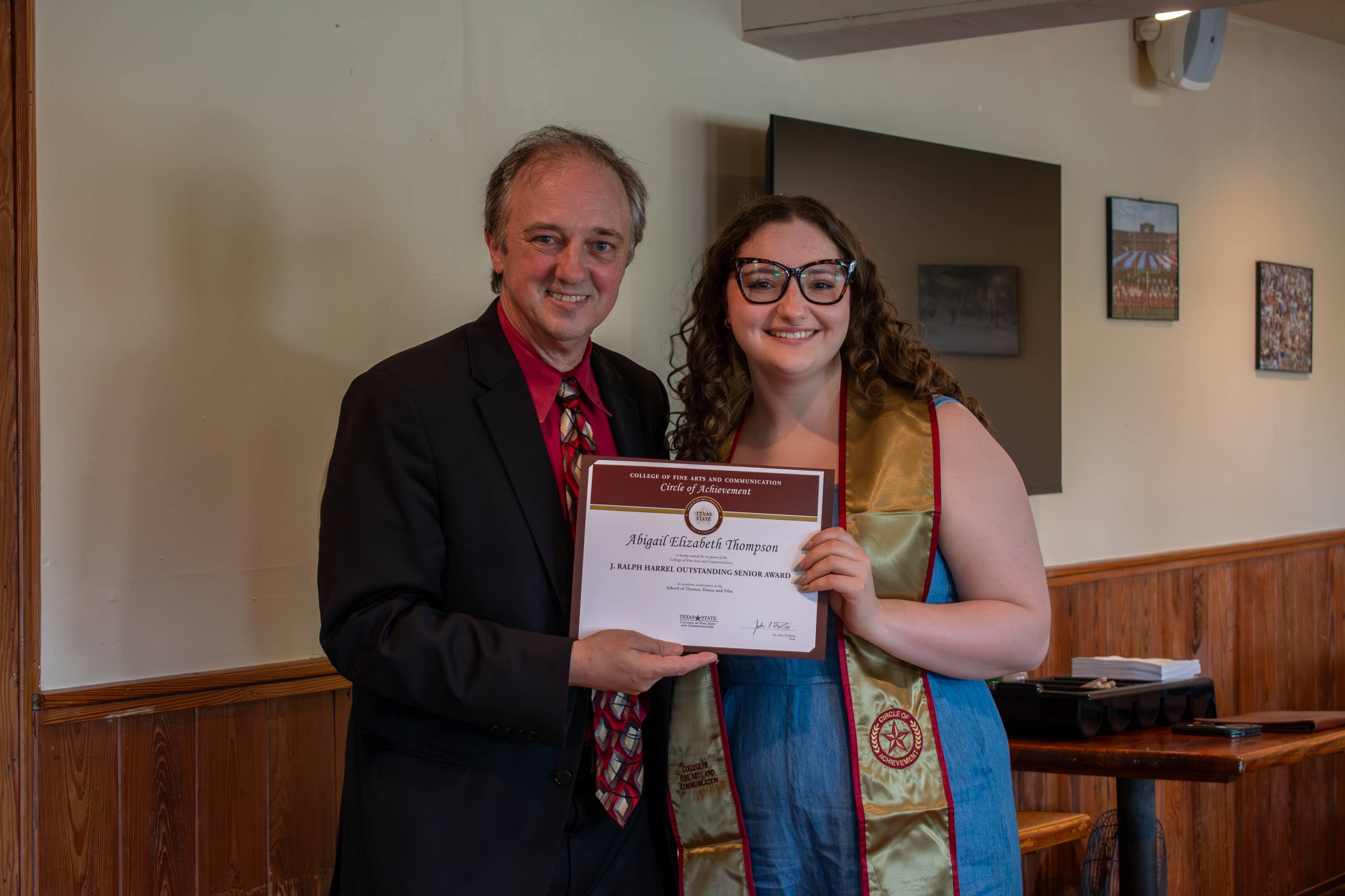 Dean Fleming posing for a photo with a Circle of Achievement recipient
