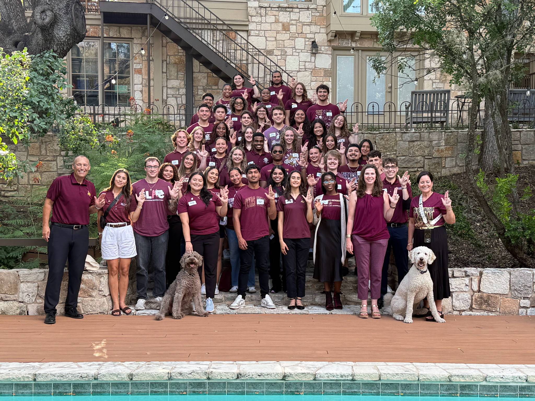 Students post with President and Mrs. Damphousse at their home