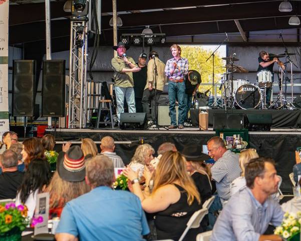 Fischer Marlow accepts an award on stage.