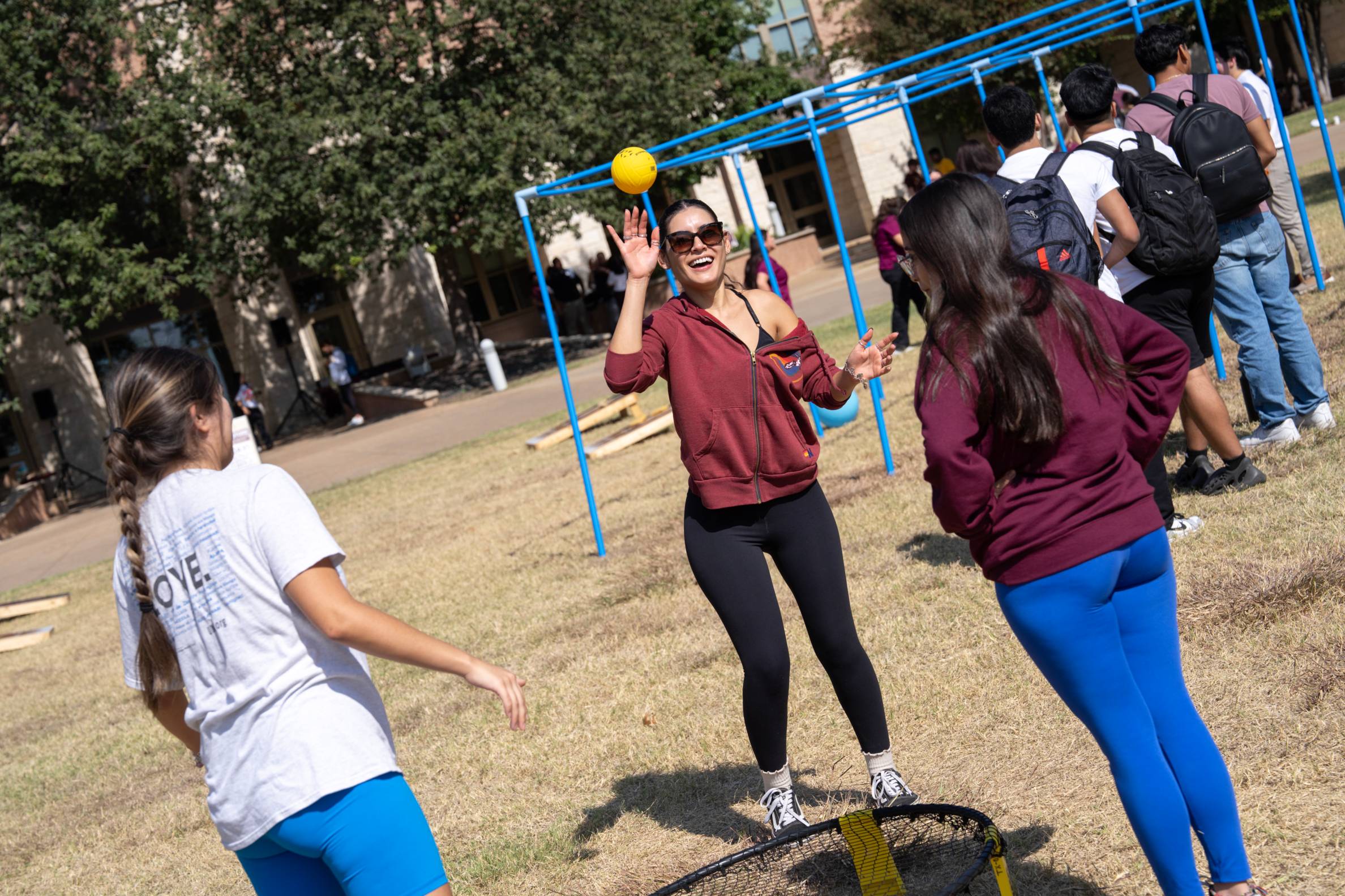 a student catching a ball