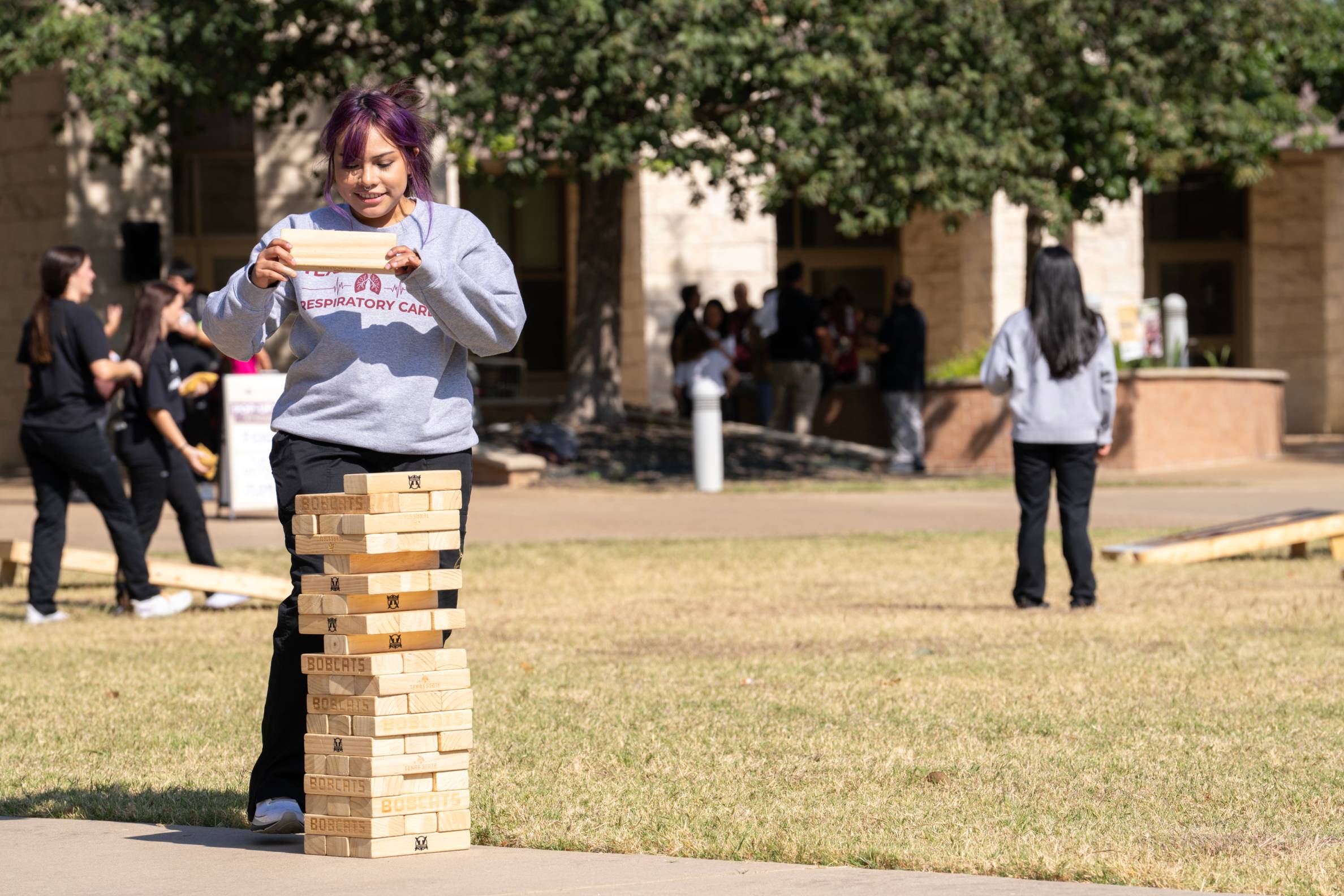 a student playing jenga