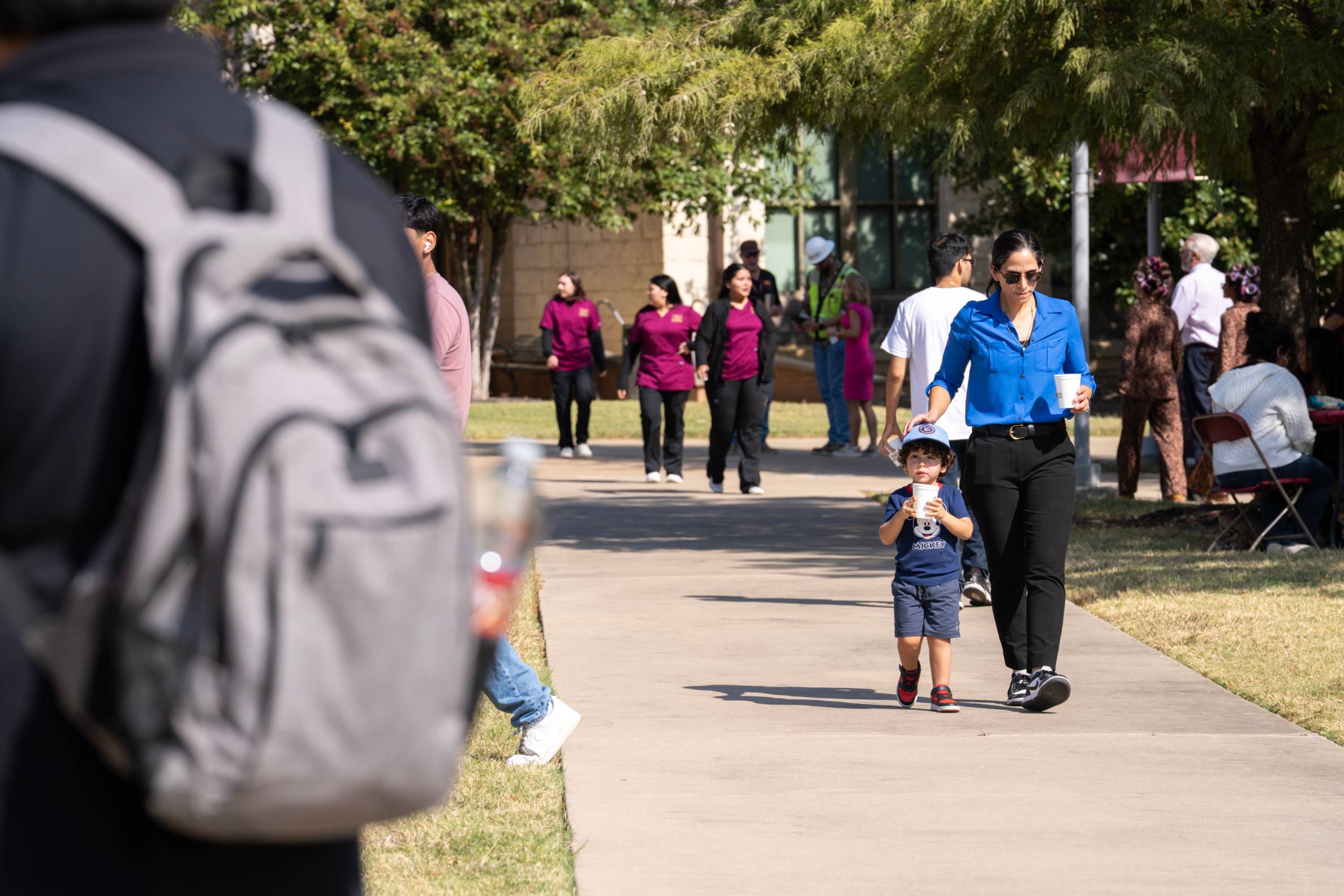 a mom walking with her son