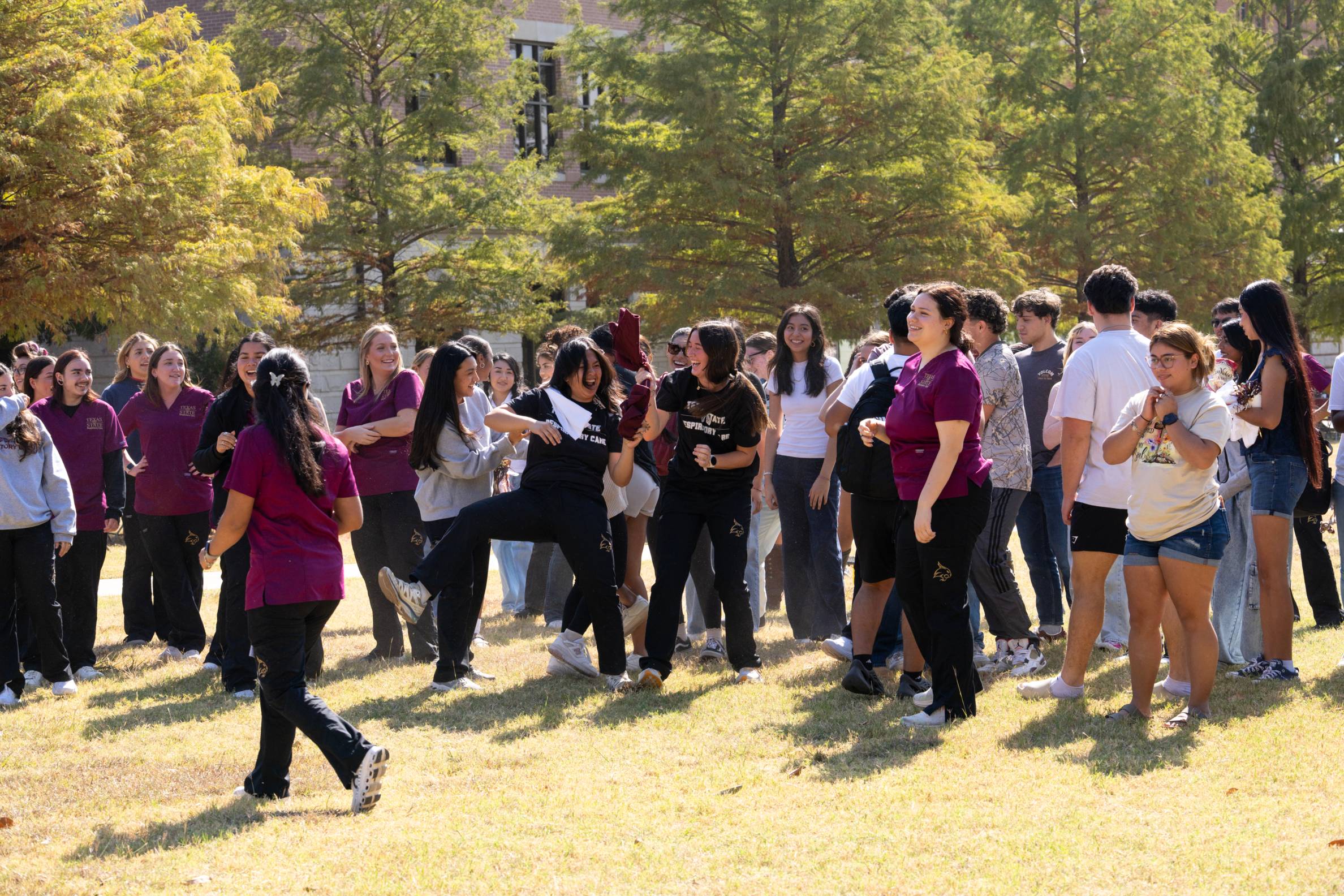 a crowd trying to catch a shirt
