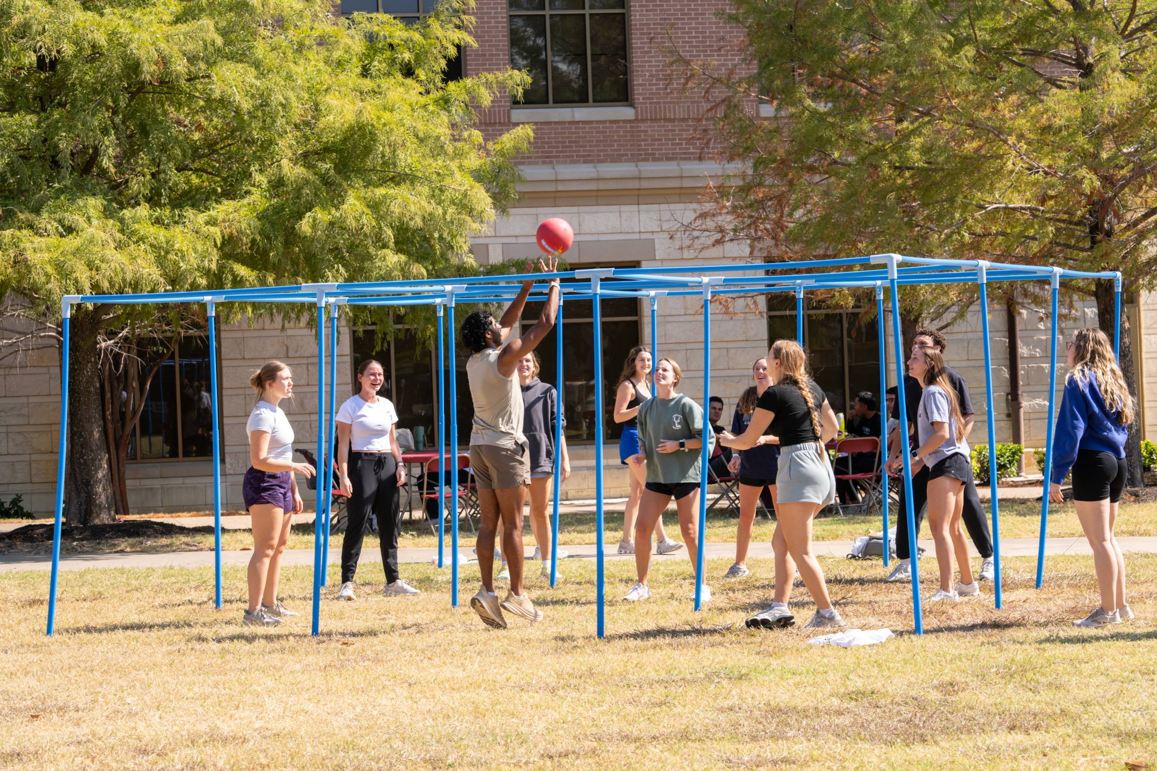 students playing with a ball