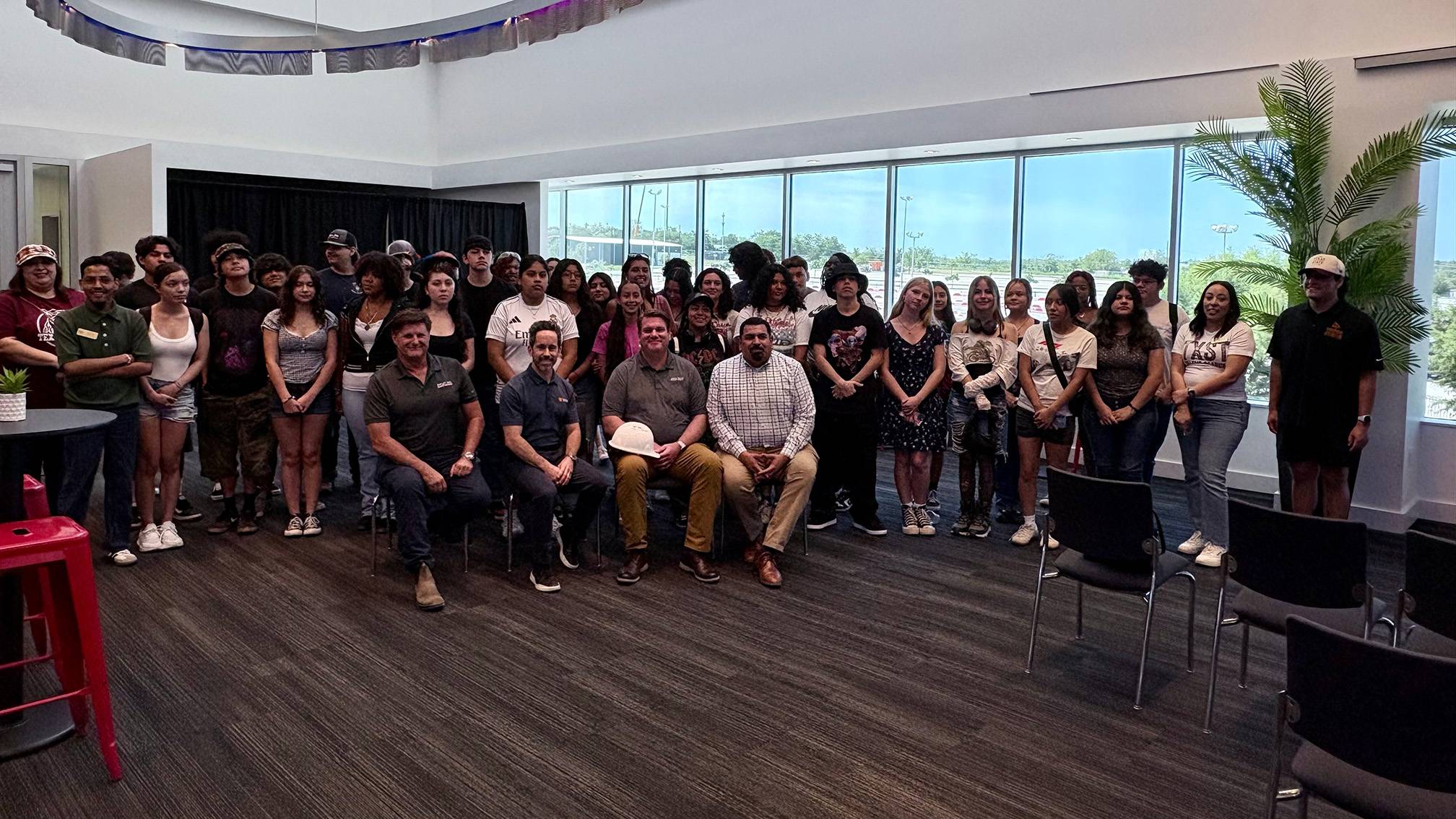 A large group of high school students and leadership pose for a photo.