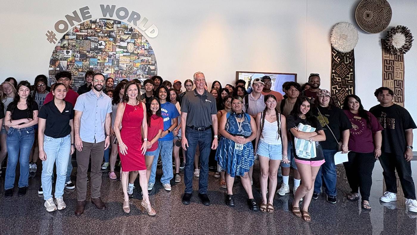A large group of high school students and leadership pose for a photo.