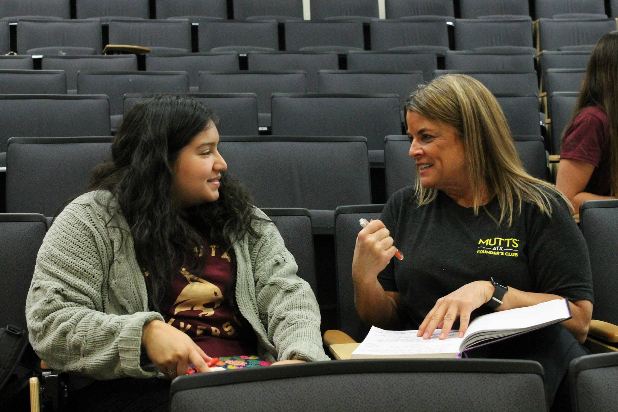 Two people talking at the Ignite 2.0 event in November 2024.